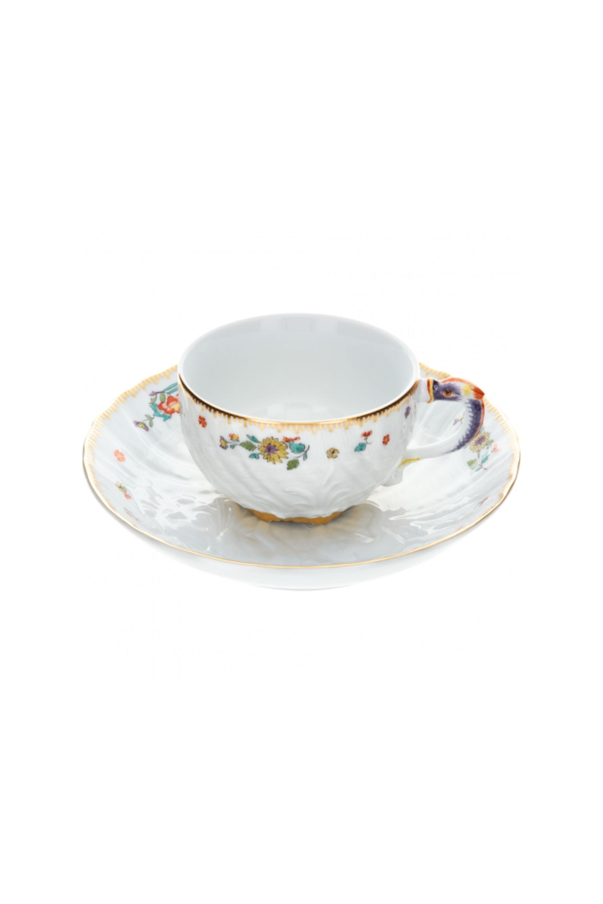 Designed by Johann Joachim Kändler, the pattern features a delicate background with radiating bands based on a scallop shell and a central well dressed with a pair of swans on water amid bullrushes, swooping cranes, and fish. Several parts of the service depict figures from Greco-Roman mythology, like Glaucus and the dolphin-riding Galatea.
