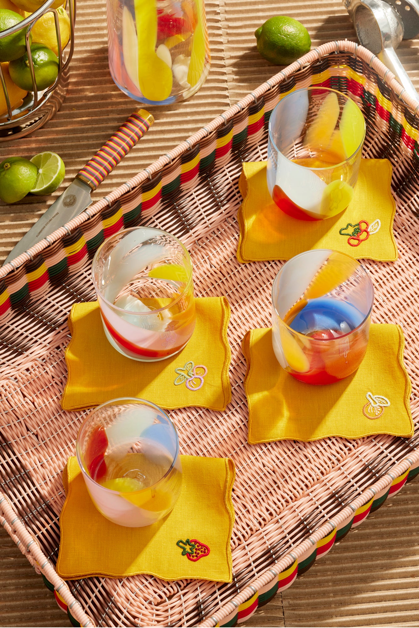 Cocktail napkins with fruit embroidery.