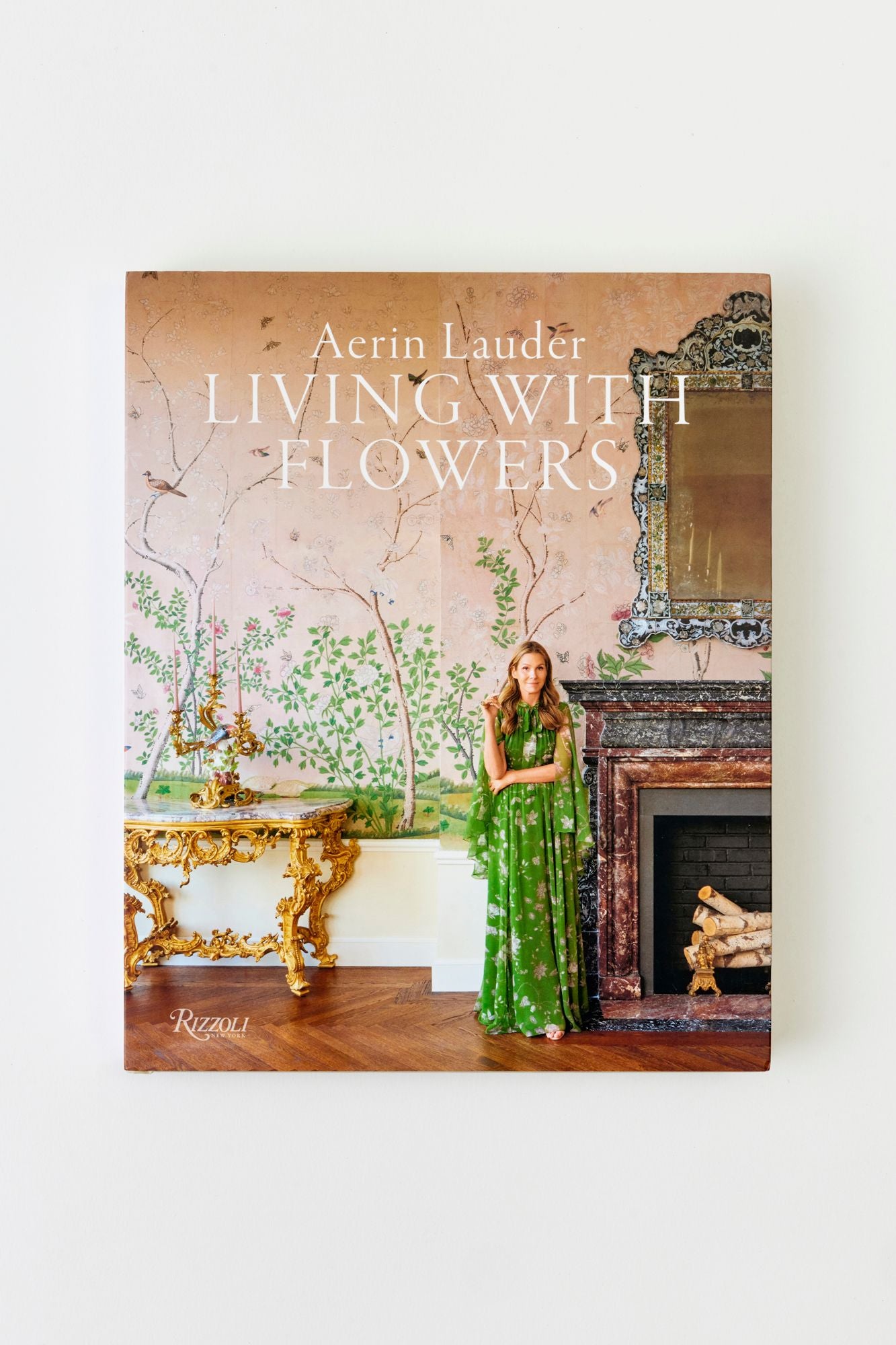 Book titled 'Living with Flowers' by Aerin Lauder on a white background