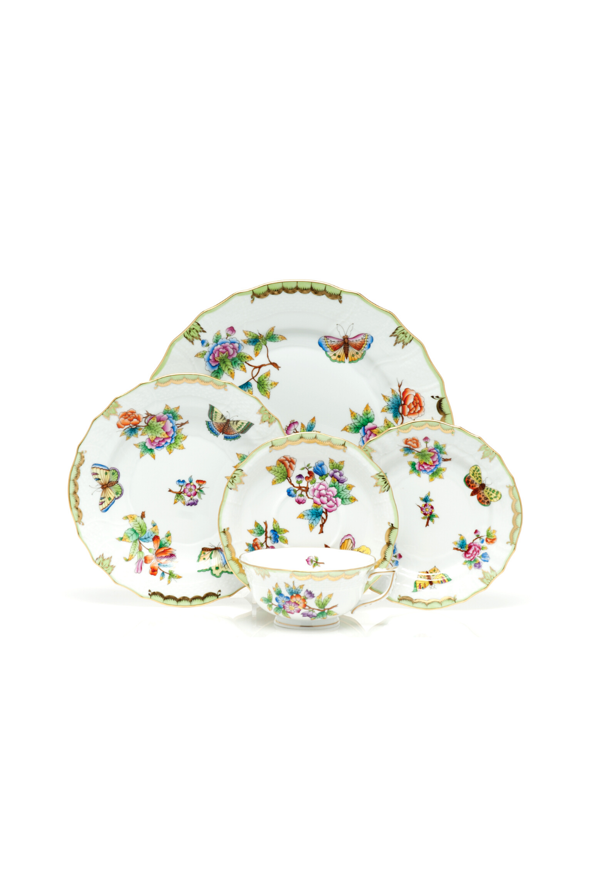 Porcelain dinnerware with butterflies and flowers. The original set, introduced in 1851 at the First World Exhibition in London, was purchased by Queen Victoria herself. Subsequently named for her, this Chinese-influenced pattern demands the skills of Herend's most talented and experienced painters.