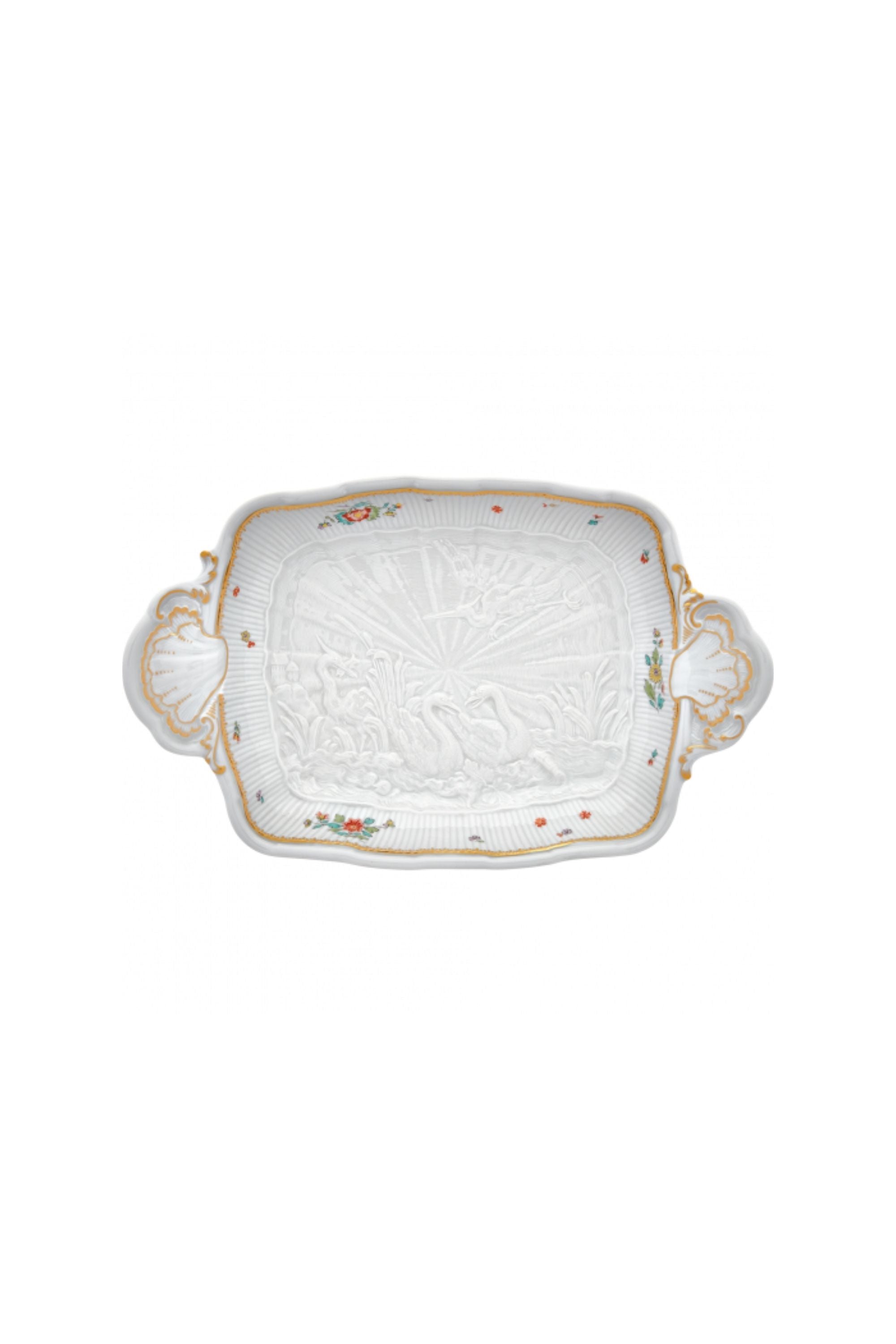 Platter designed by Johann Joachim Kändler, the pattern features a delicate background with radiating bands based on a scallop shell and a central well dressed with a pair of swans on water amid bullrushes, swooping cranes, and fish. Several parts of the service depict figures from Greco-Roman mythology, like Glaucus and the dolphin-riding Galatea.