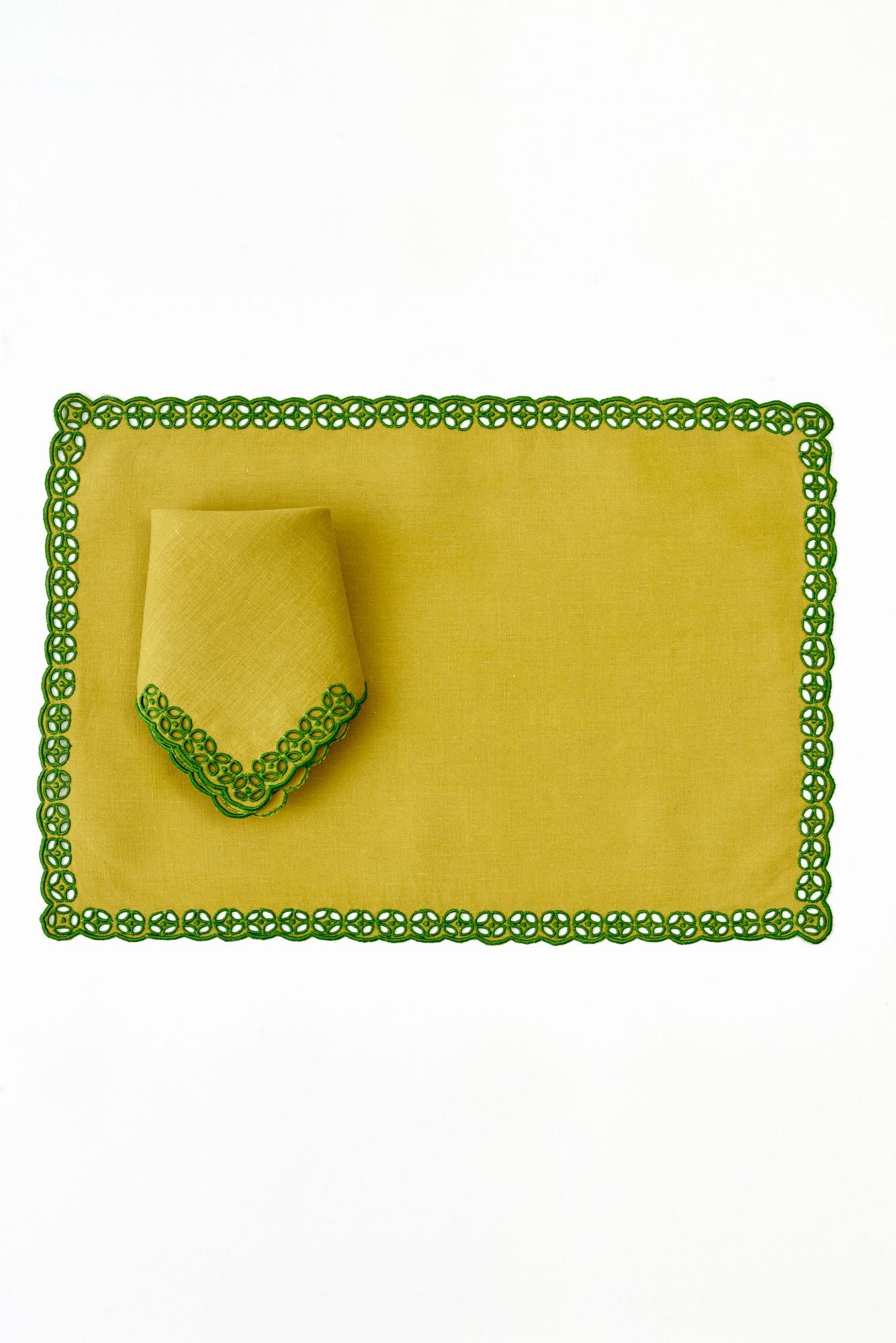 Green napkin and placemat with lace detailing