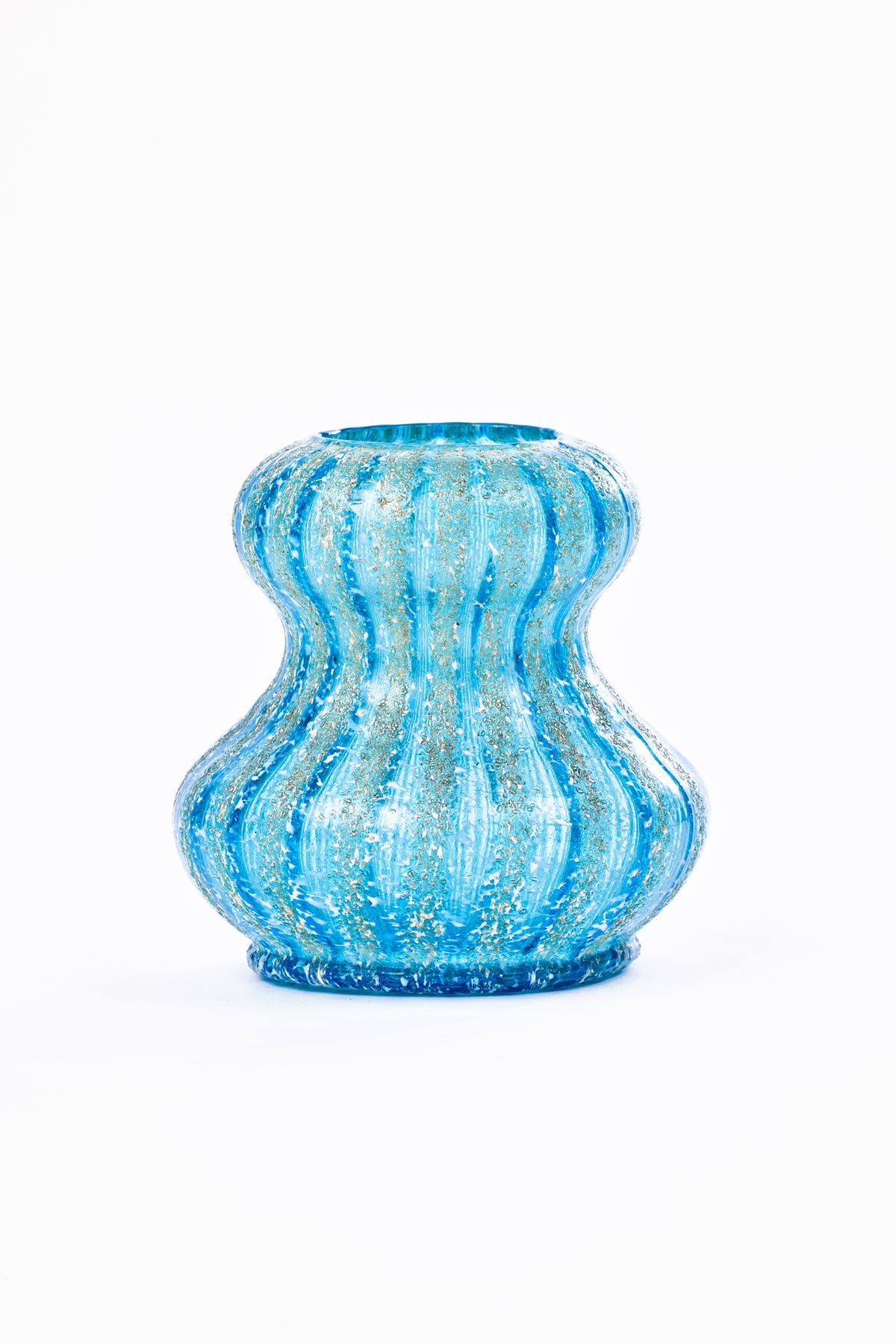 A small decorative glass vase with a wavy, ribbed shape and embedded with shimmer and white flecks, shown on a plain white background.