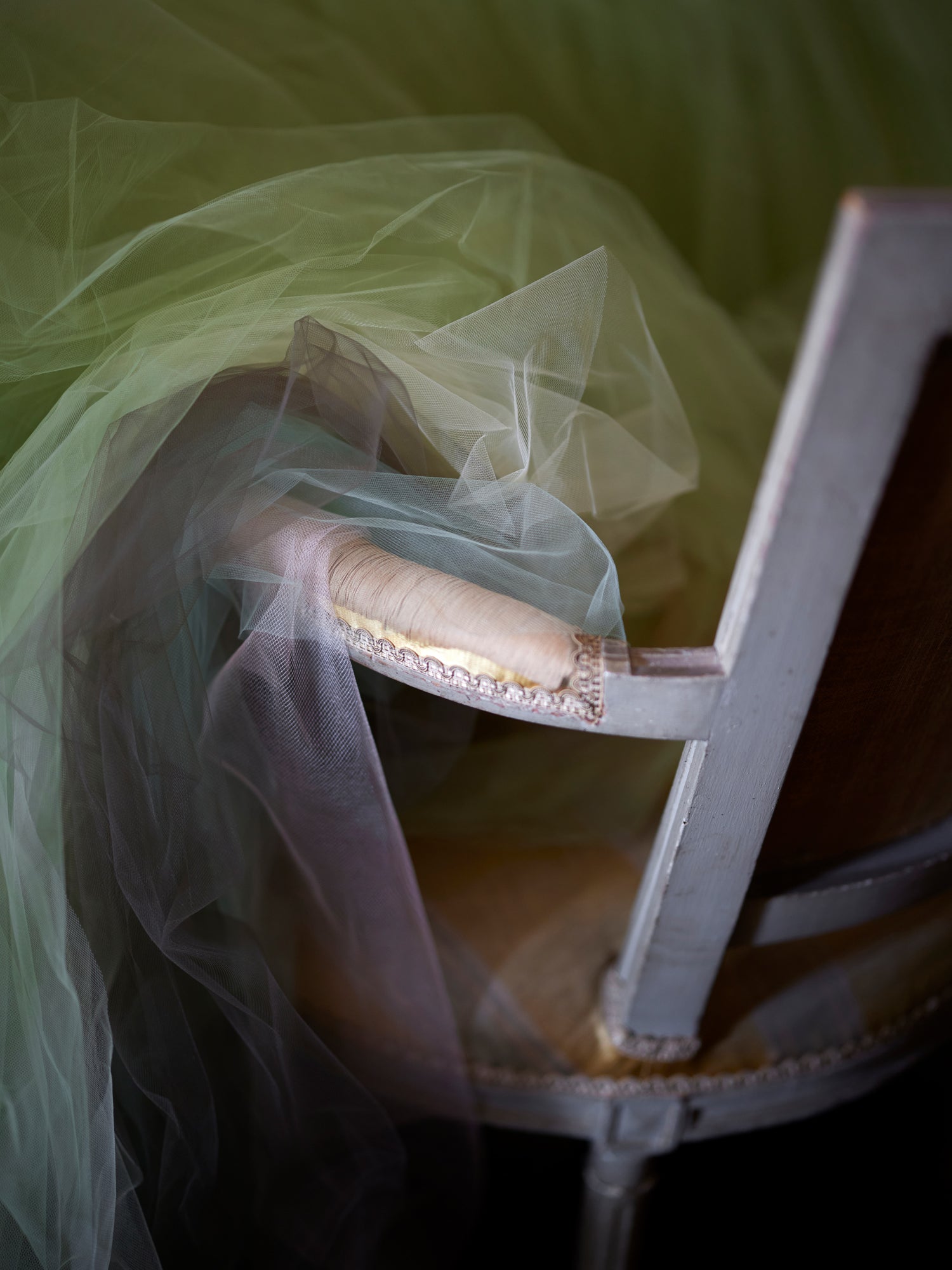 Closeup of elegant table setting with tulle table skirt.