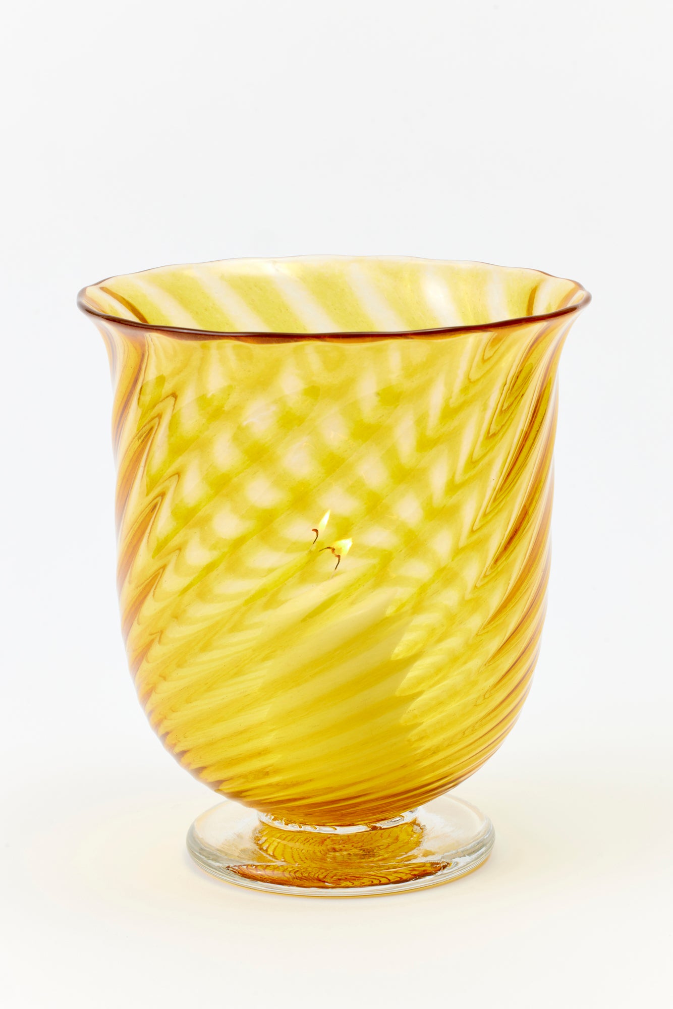 Hand blown twisted glass vase in a golden yellow color.