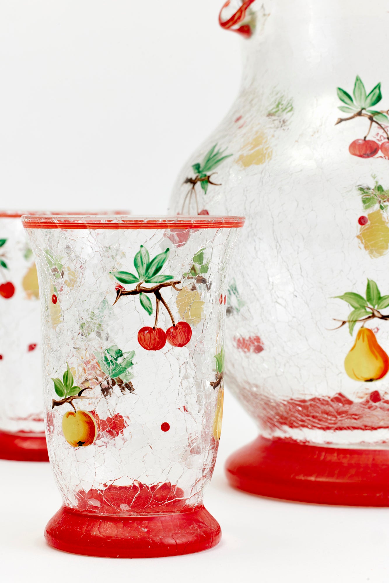 Vintage pitcher and tumblers with cherries handpainted onto it.