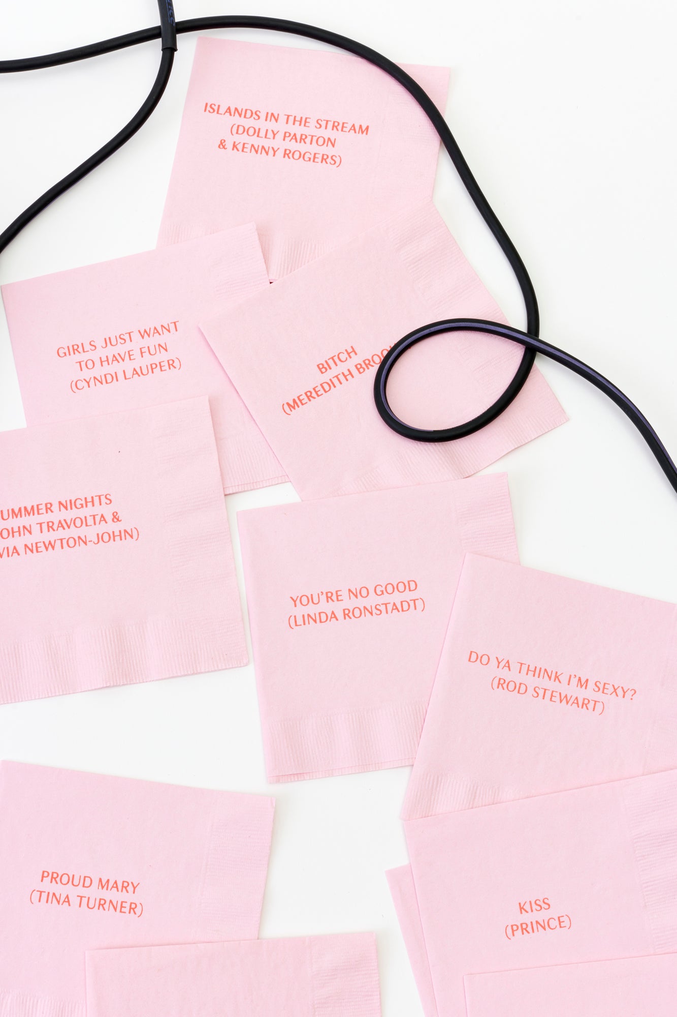 Cocktail napkins with karaoke hits.