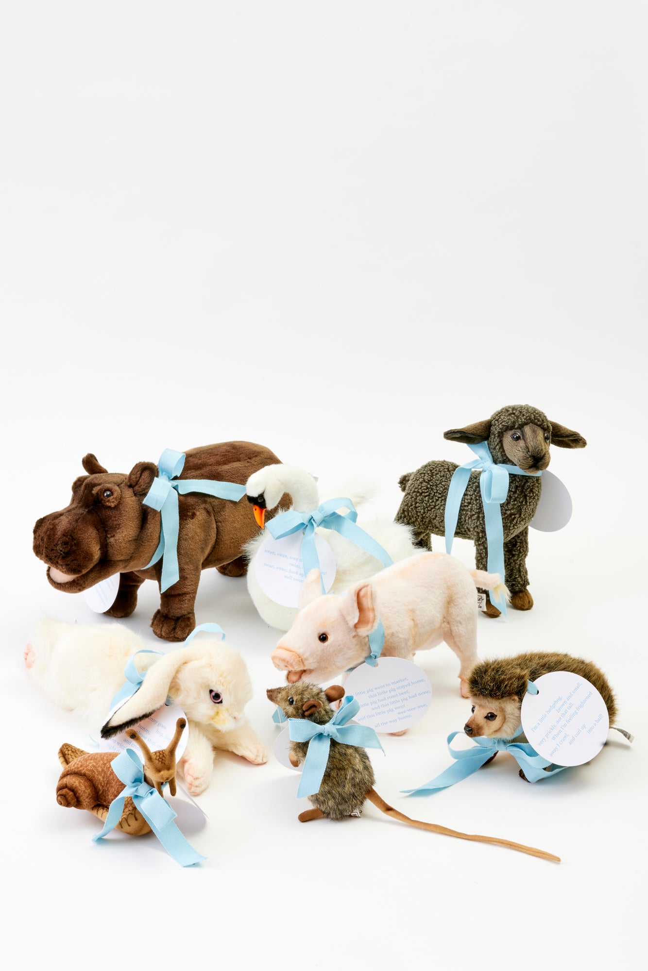 Stuffed farm animals with blue bow.