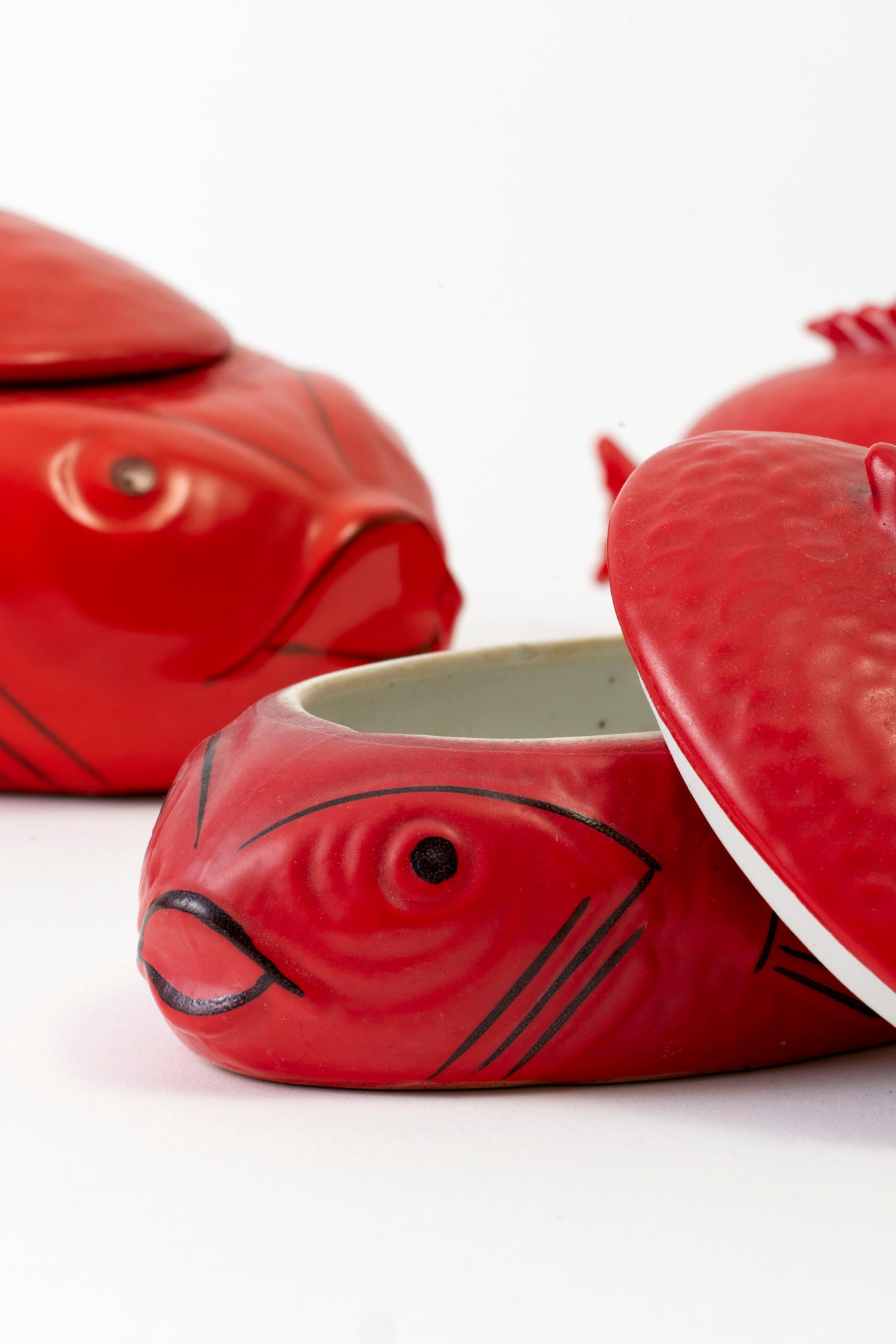 A pair of Japanese lidded fish cocottes.