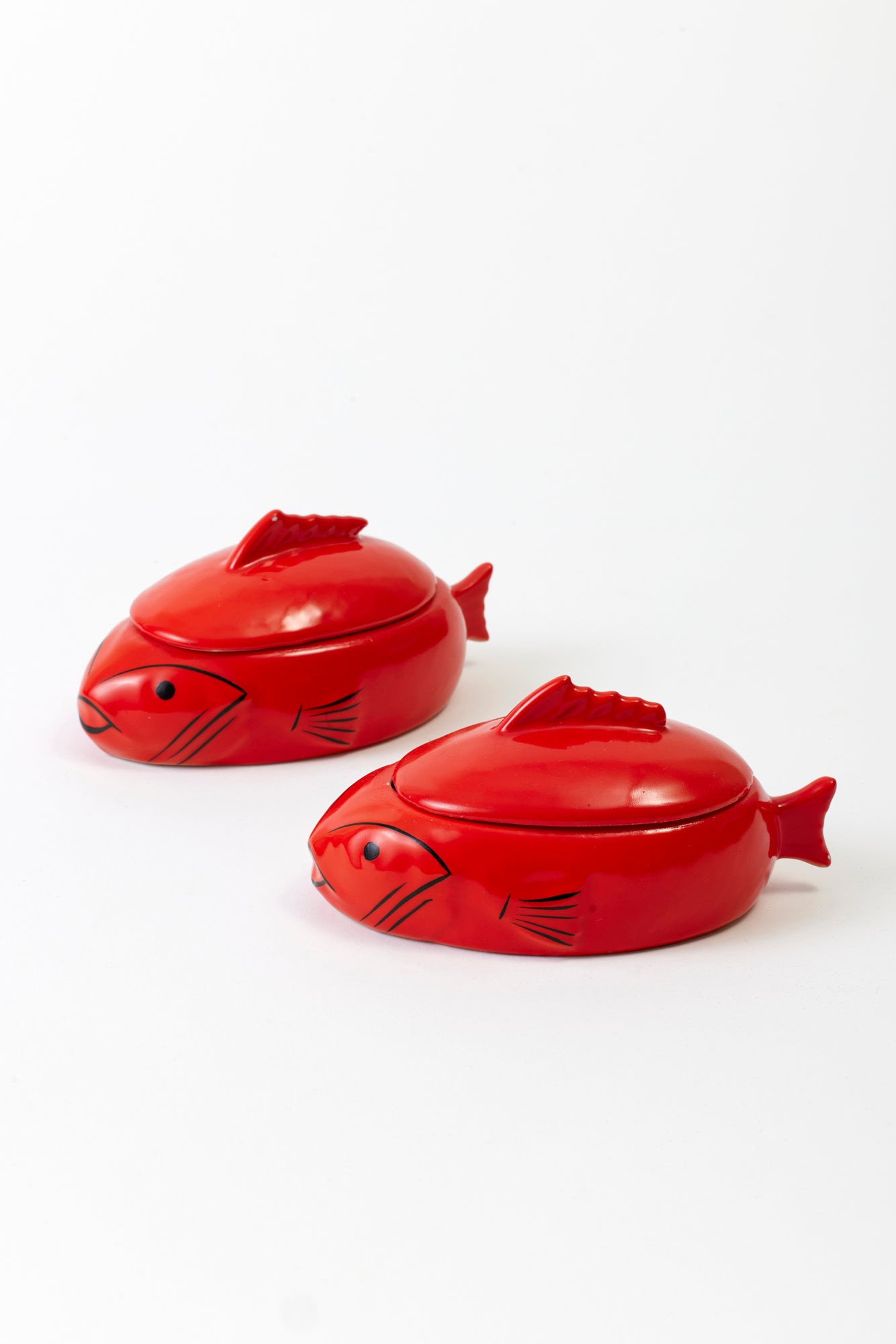 A pair of Japanese lidded fish cocottes.