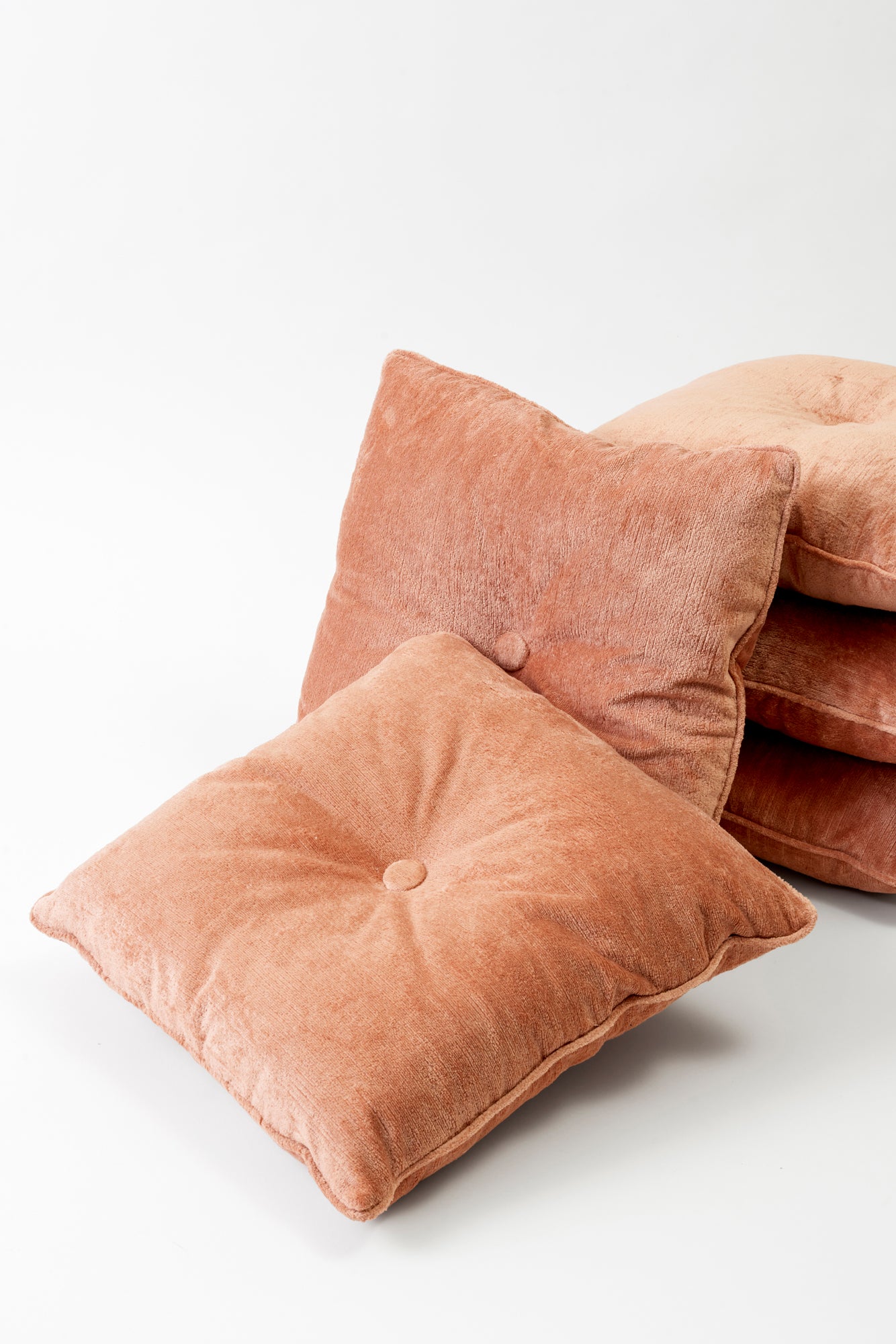 Velvet rose colored pillows.