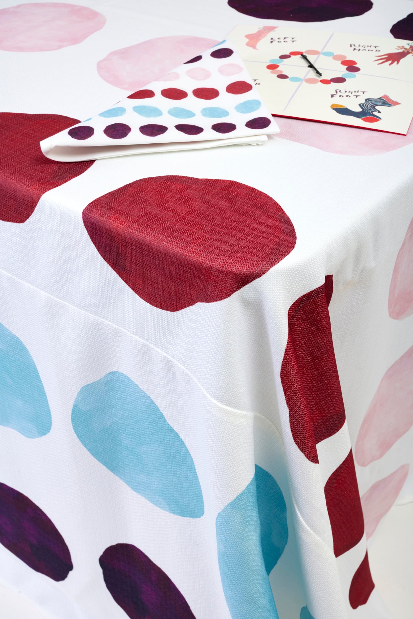 Tablecloth and matching napkins. Artwork by Happy Menocal.