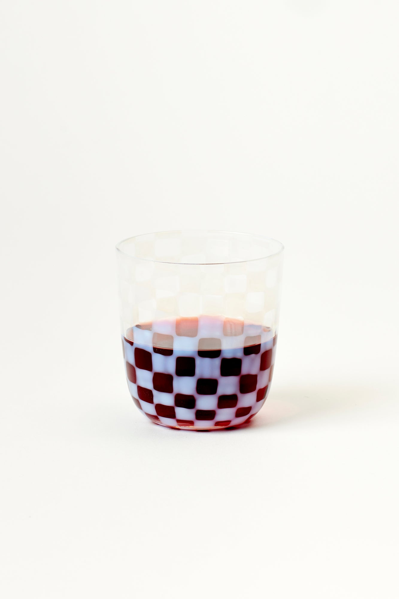 Tumblers with milky checkerboard pattern.