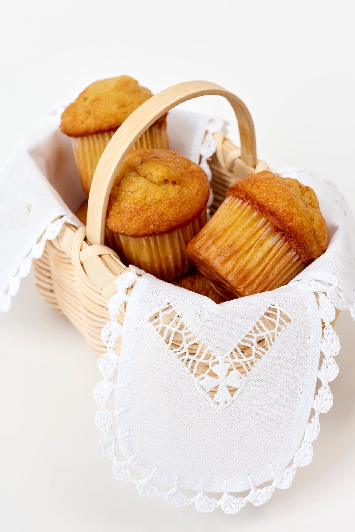 Handwoven basket with a delicate linen liner for serving cheese straws during cocktails.