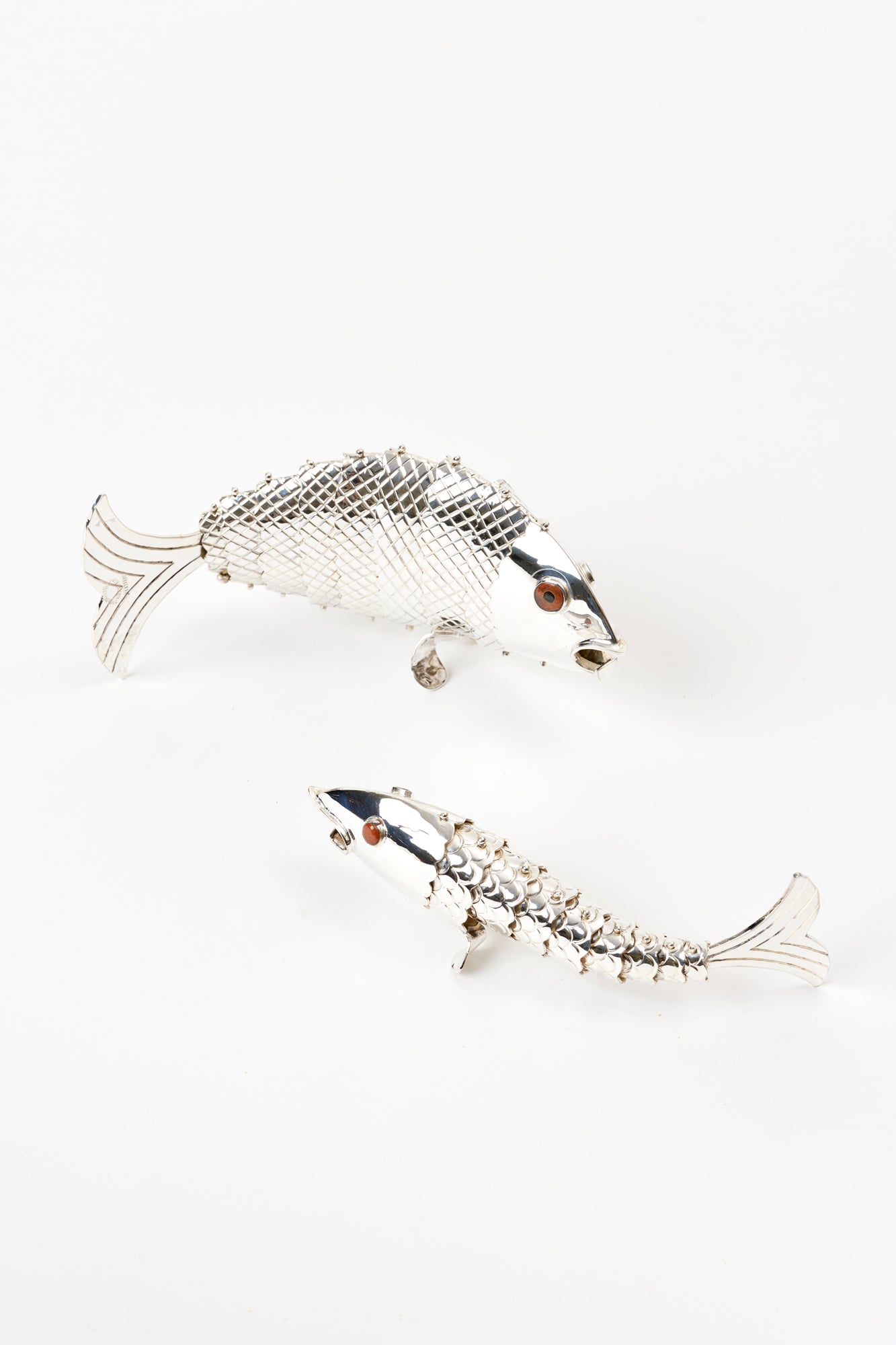 Silver plated articulated fish.