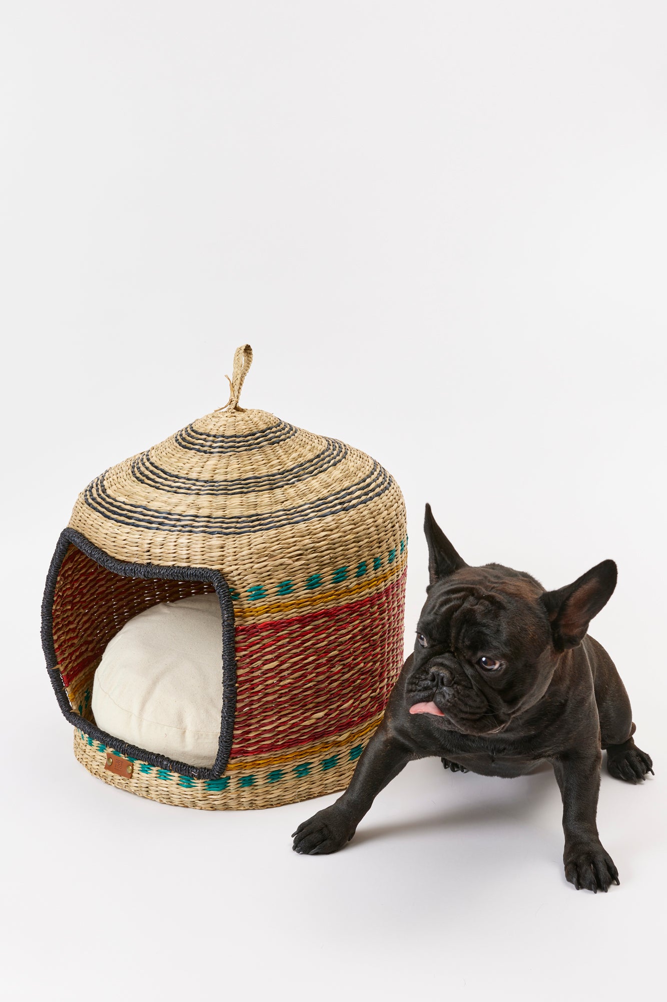 This handmade woven dog hut gives your furry friend a snug and secure space.