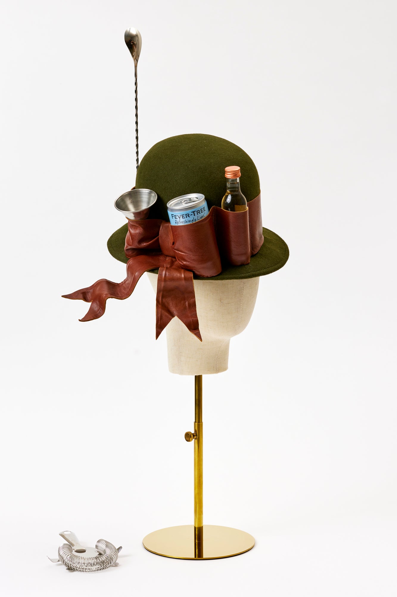 Handmade hat with shot glass, cocktail stirrer, and vodka bottle.