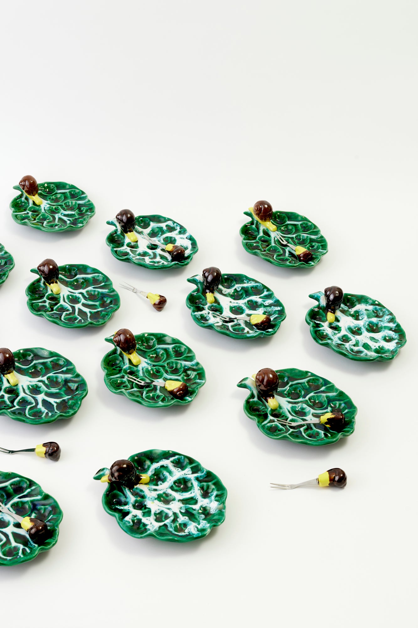 Glorious set of 12 vintage ceramic escargot plates and forks.