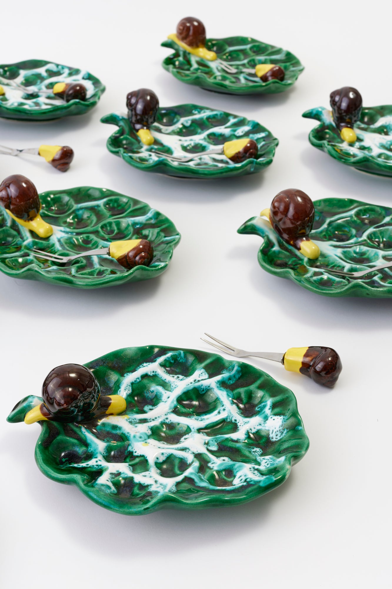 Glorious set of 12 vintage ceramic escargot plates and forks.