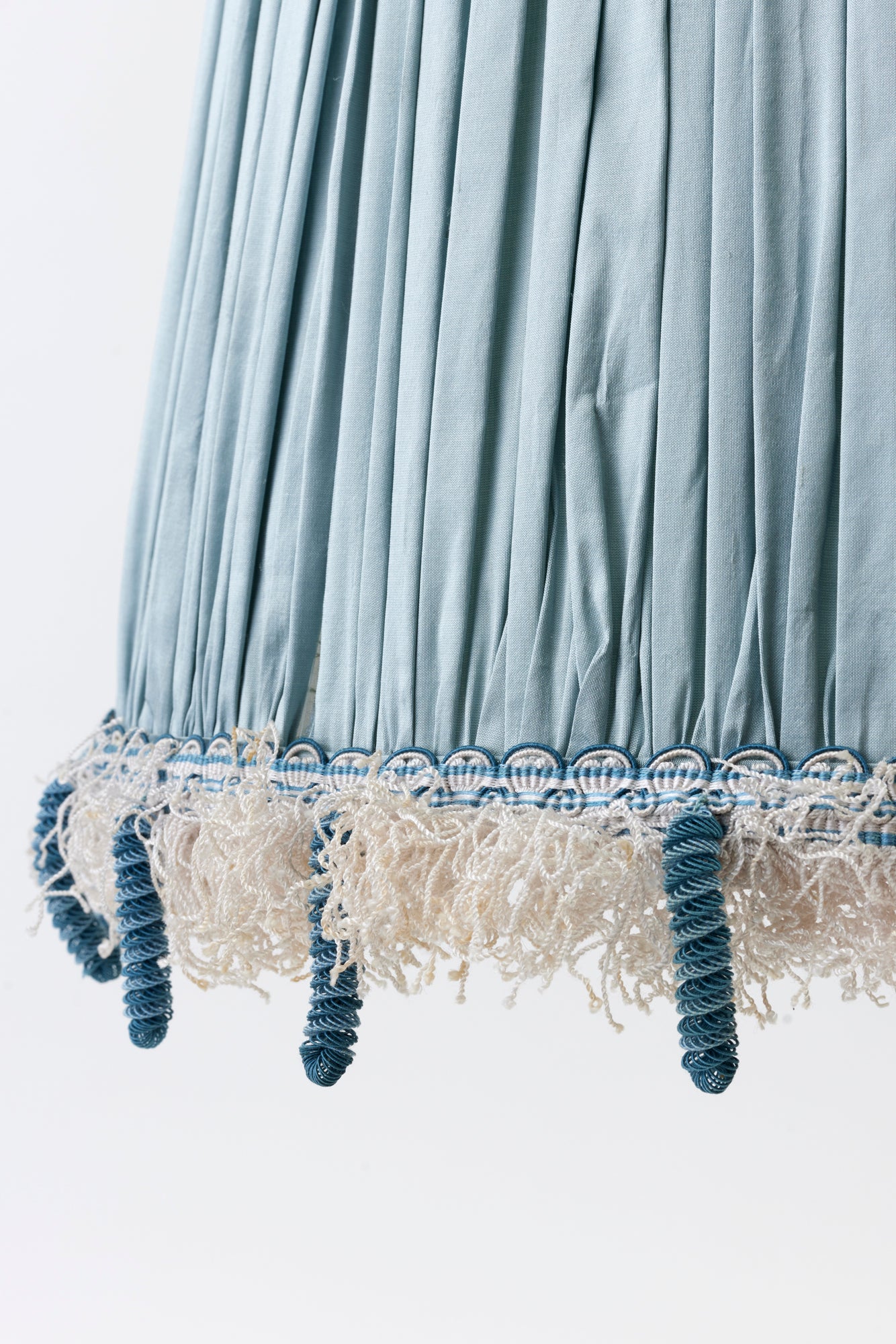 Shirred silk shade is trimmed with tassel fringe from Paris.
