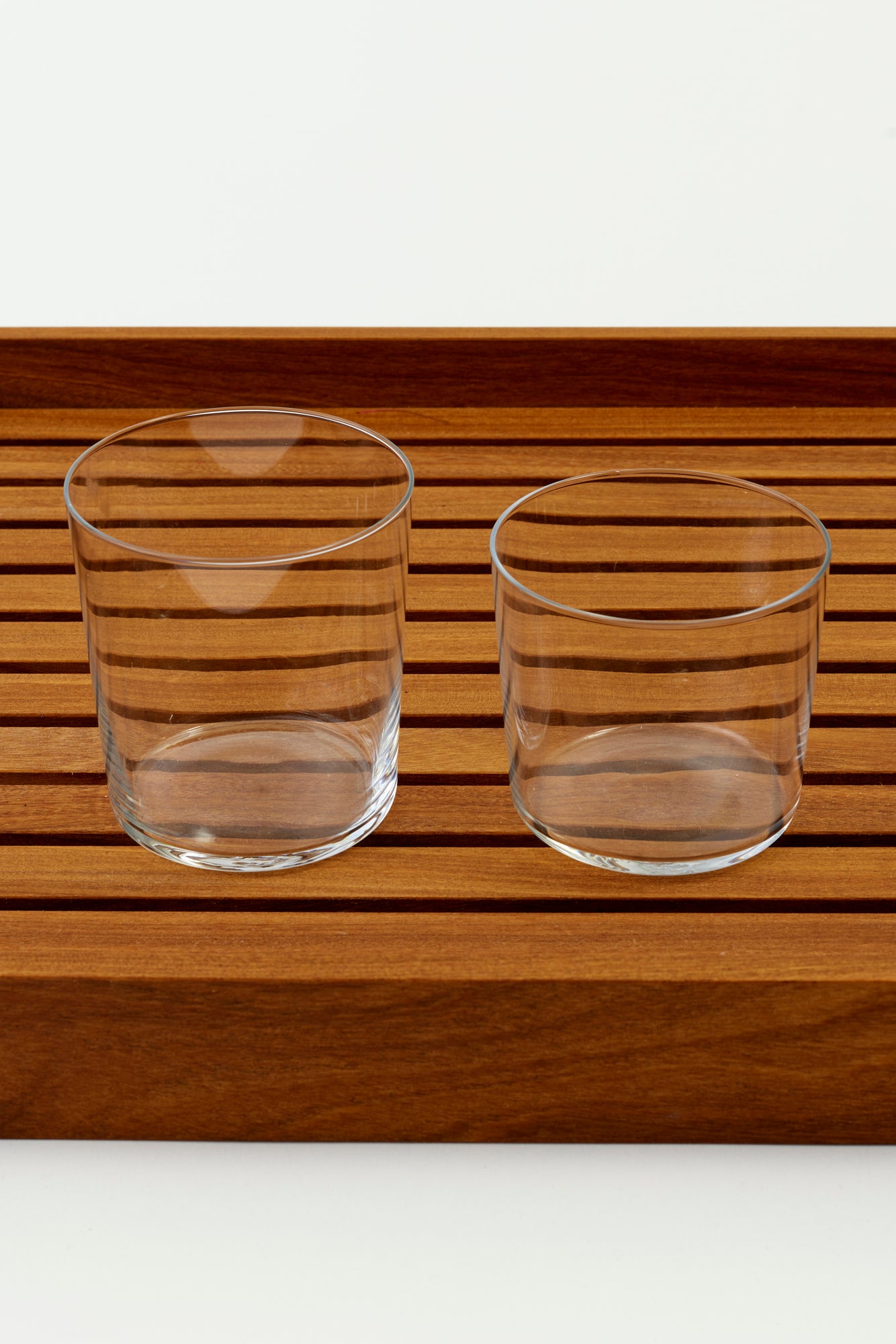 Set of four modern tumblers with fine walls and a stackable design.