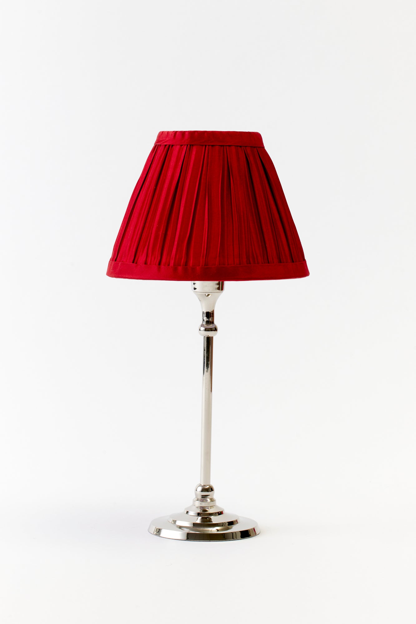 Marvelous hand-pleated red silk shade.