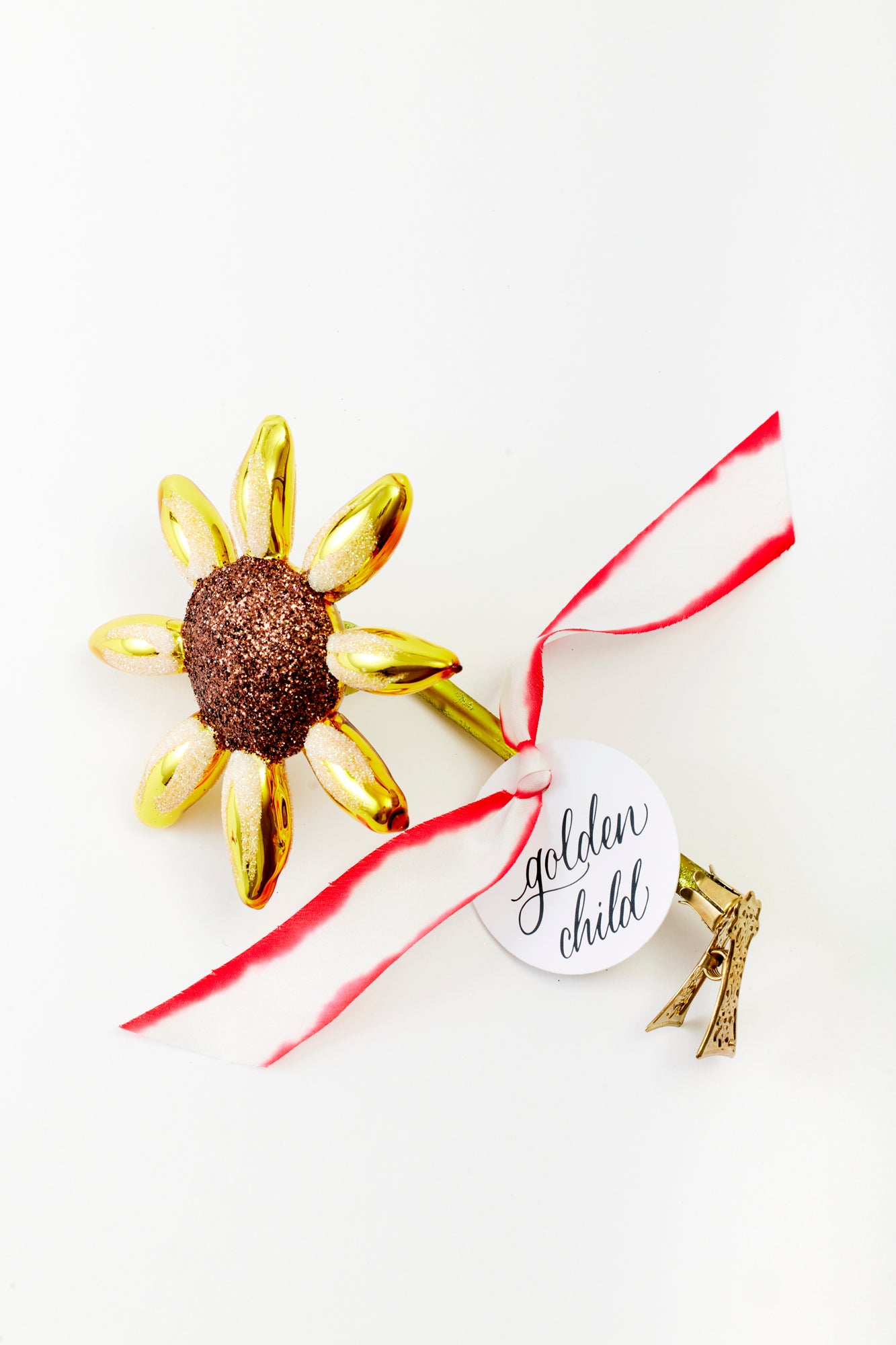 Hand-painted golden sunflower glass ornament crafted in Poland.