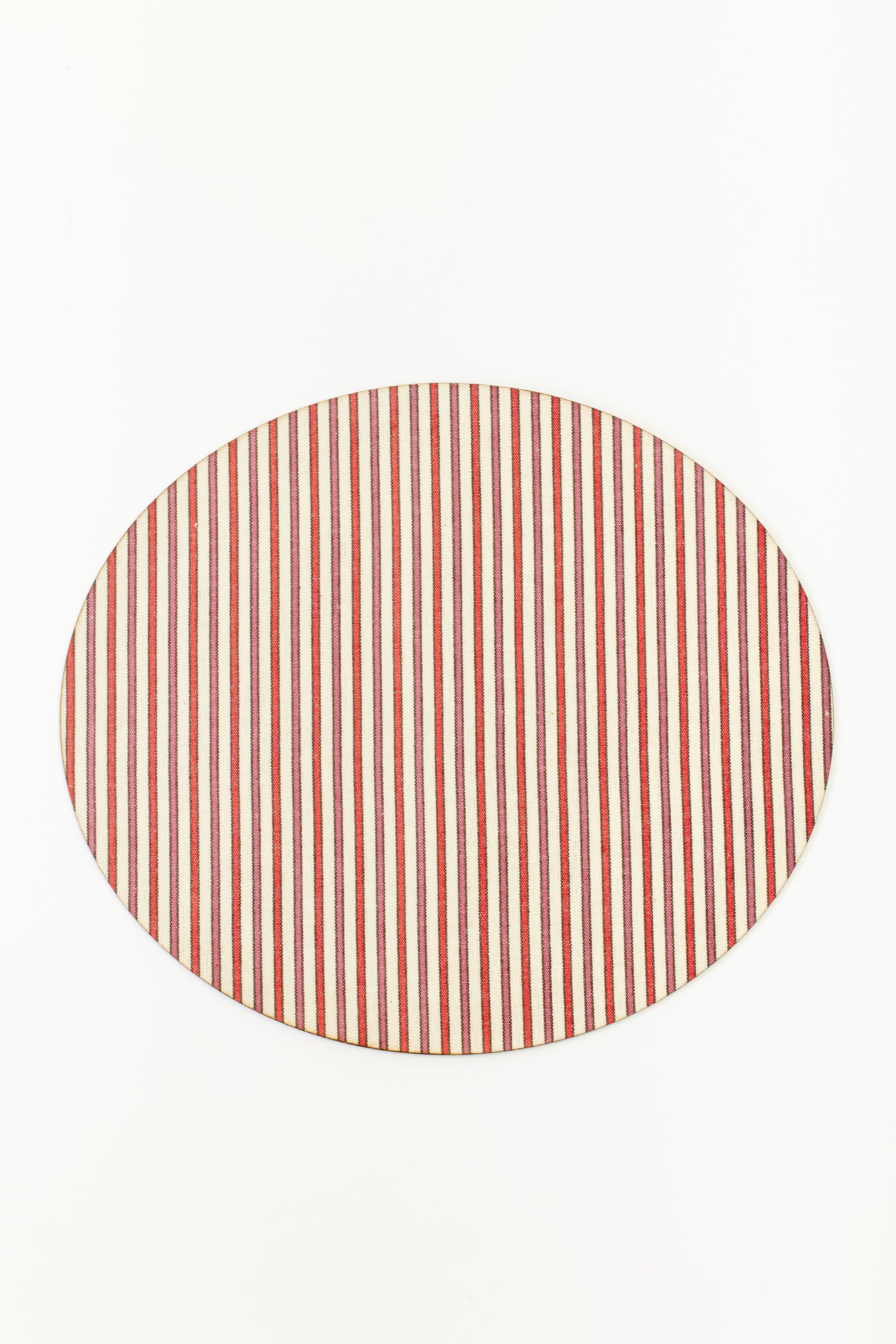Old fashioned hardback placemat topped with a heavy duty blend of 60% linen, 40% cotton that has been coated for indestructibility. Oval shaped placemat with red, pink, and white vertical stripes.