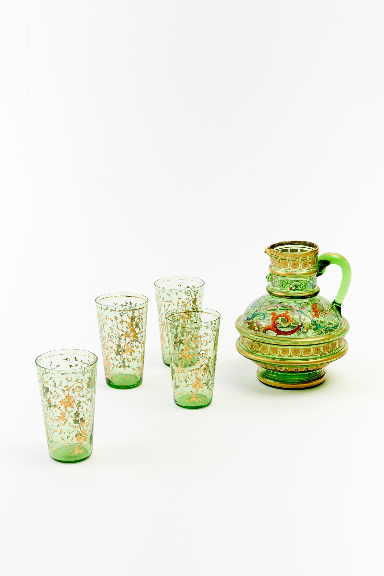 Detailed vintage green Bohemian pitcher and glasses.
