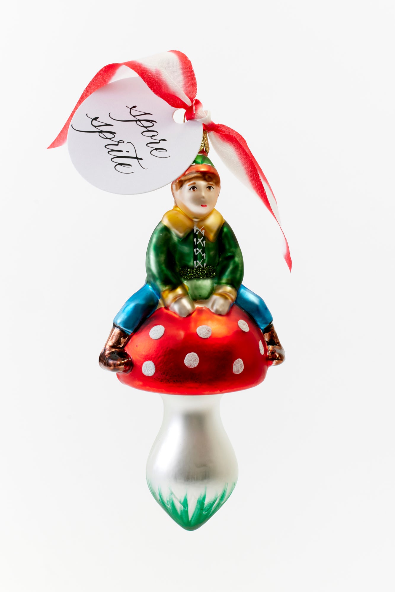 Hand-painted glass ornament with boy on a mushroom crafted in Poland.