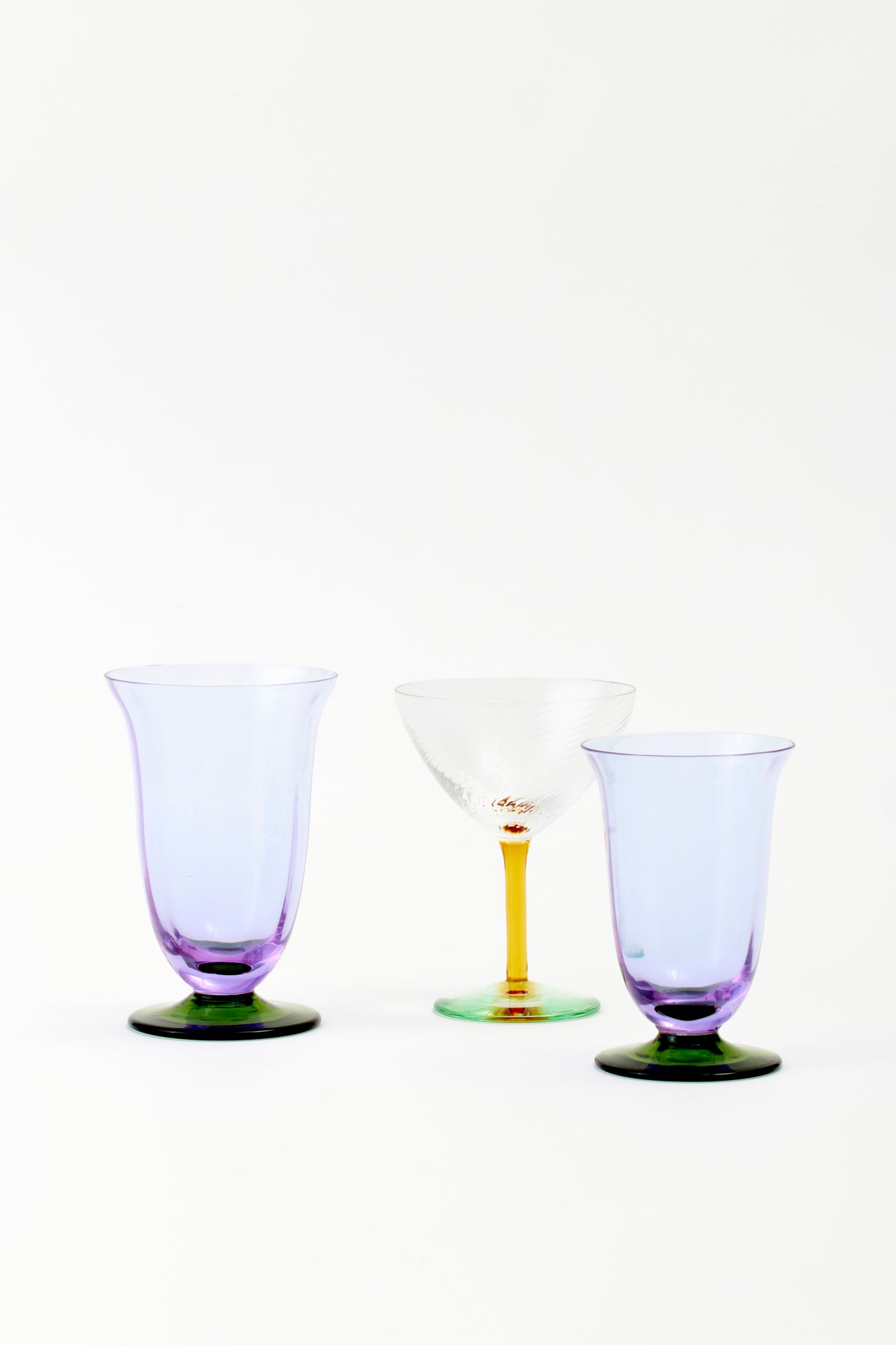 Purple and green glass water and wine glass.