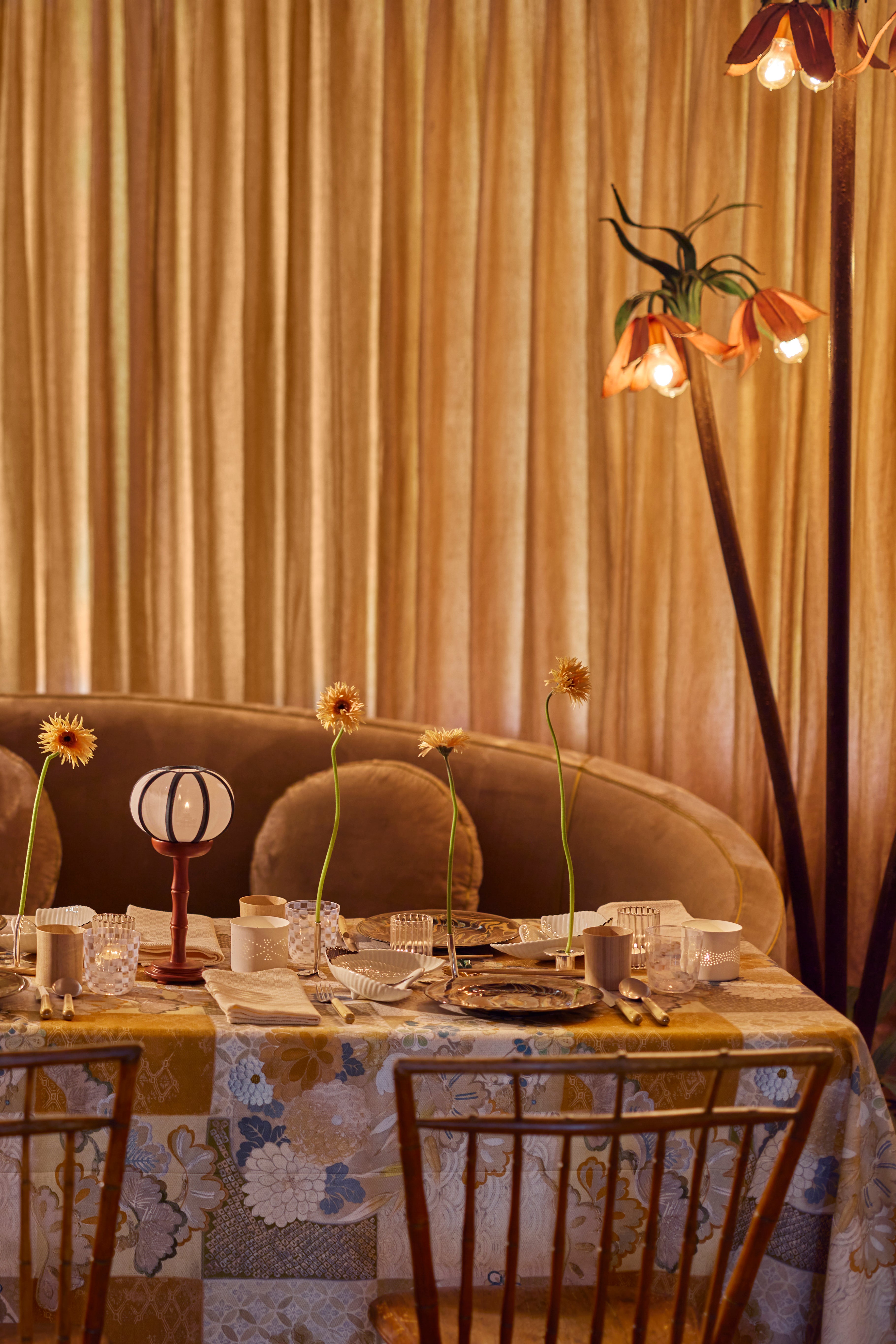 This tablecloth has a cream and clay Japanese checkerboard (Ichimatsu) pattern is elegantly earthy, while also evoking the lushness of Old Hollywood with the addition of intricate Chrysanthemums.