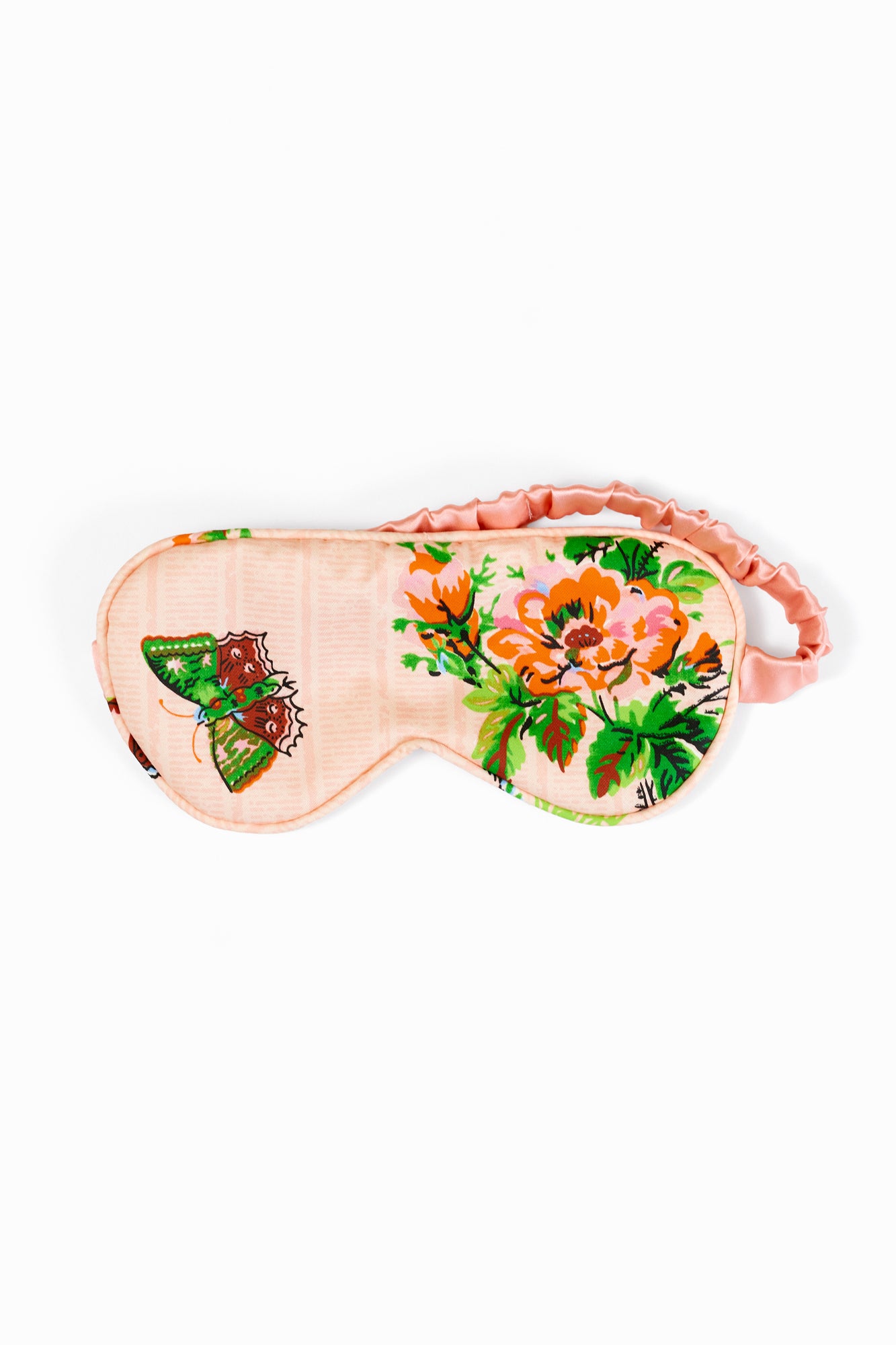 Pink silk-backed eye mask with floral and butterfly design on a white background.