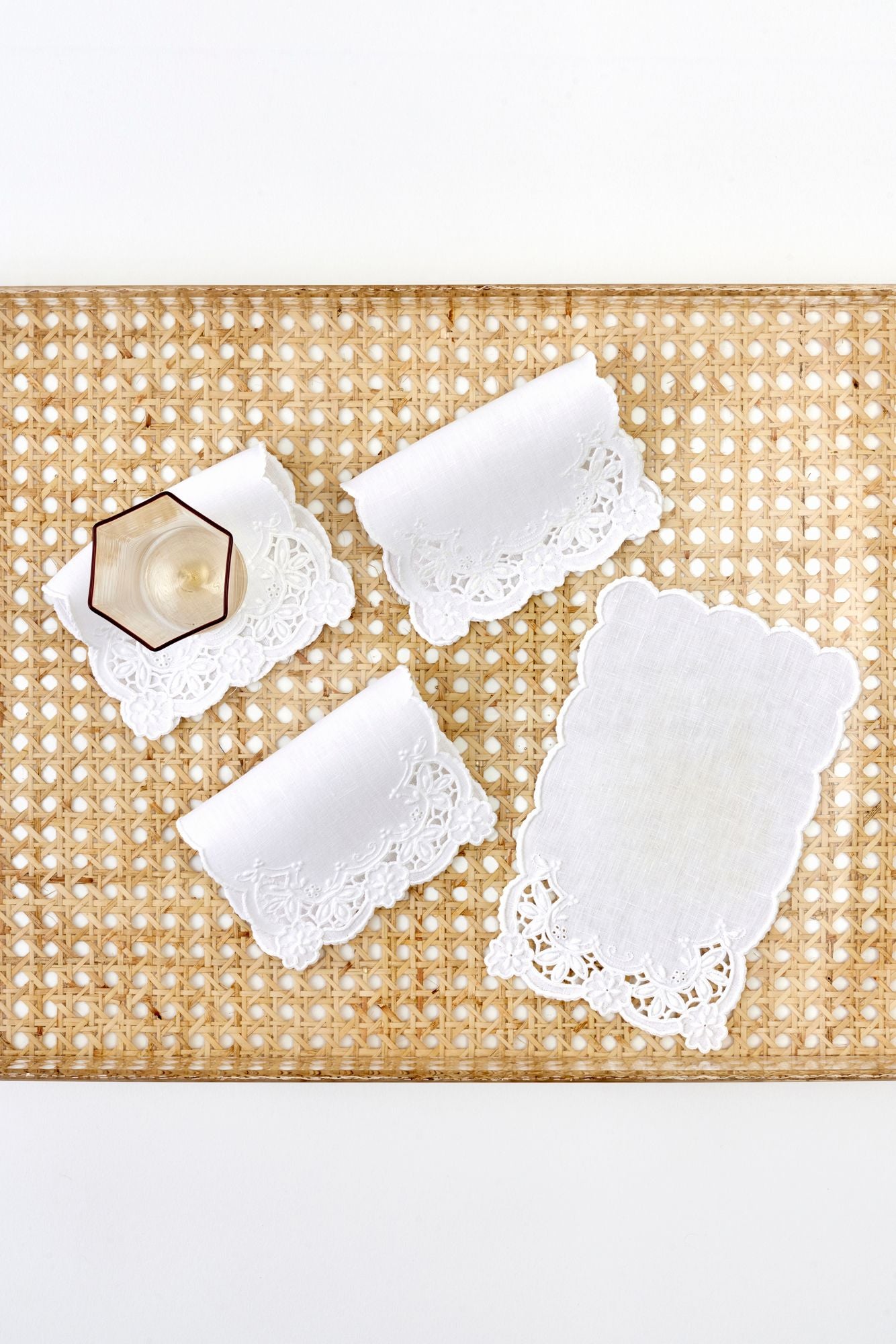 SET OF 4 FLORAL OPENWORK LINEN COCKTAIL NAPKINS.