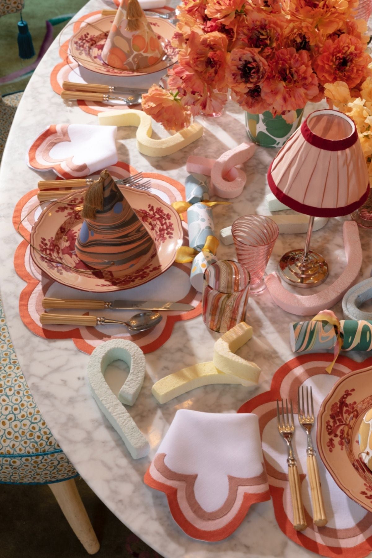 Linen dinner napkins in Persimmon with triple French stitch appliqué scallops made in Madeira, Portugal, exclusively for Houses & Parties.