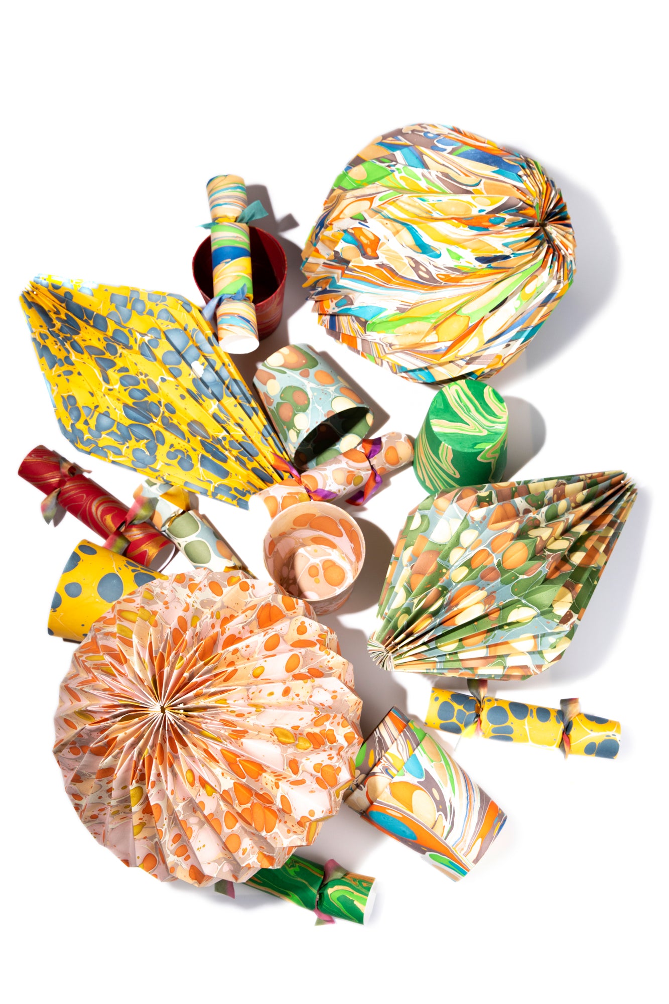 Artisan paper-covered cachepots with a plastic liner. Made to fit pots of standard seasonal bulbs or orchids.