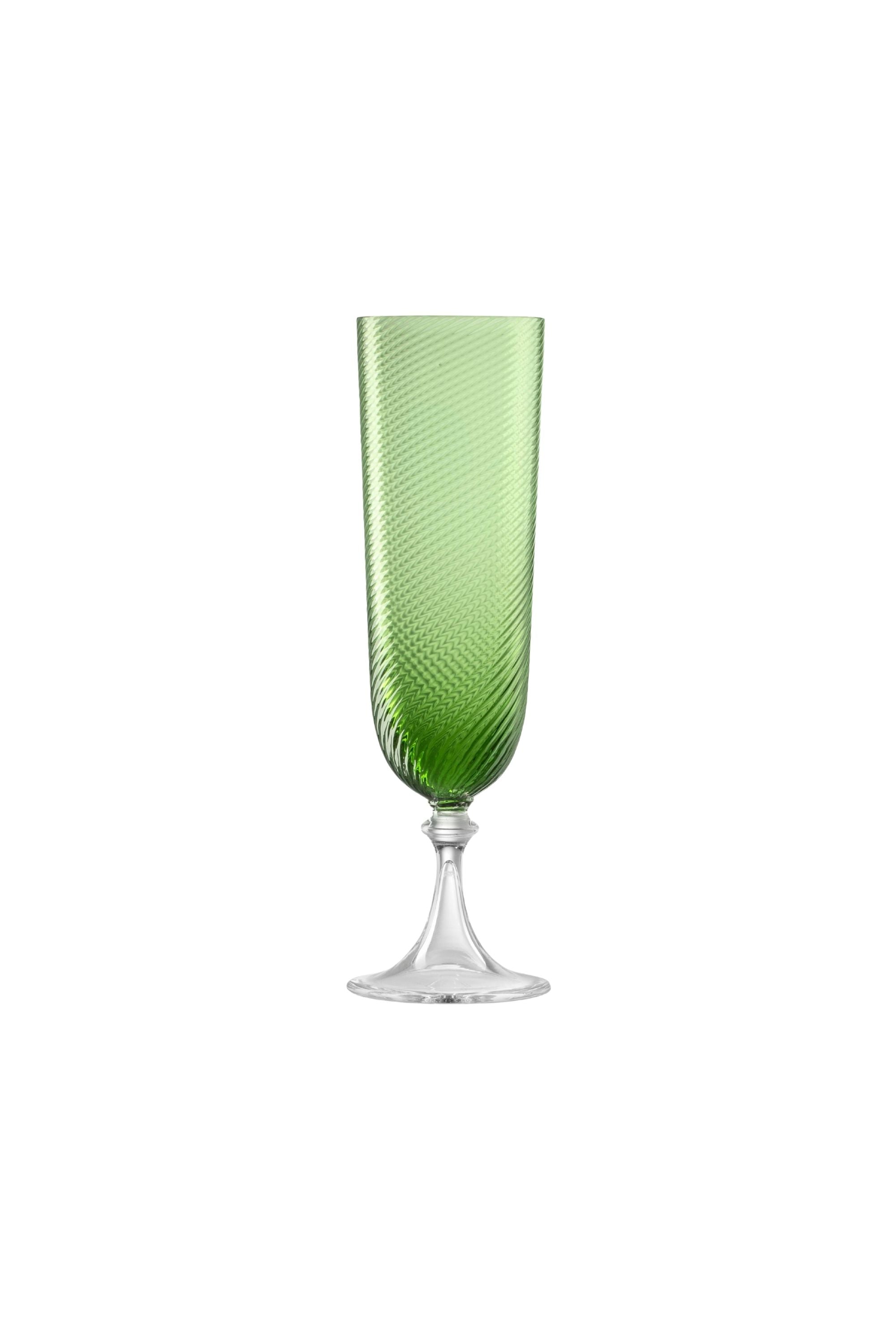 Handblown on the Venetian Island of Murano, these glasses feature a handmade stem and twisted texture in Green. The elegant form made in glass makes this a versatile chameleon to be used with stoneware or china.