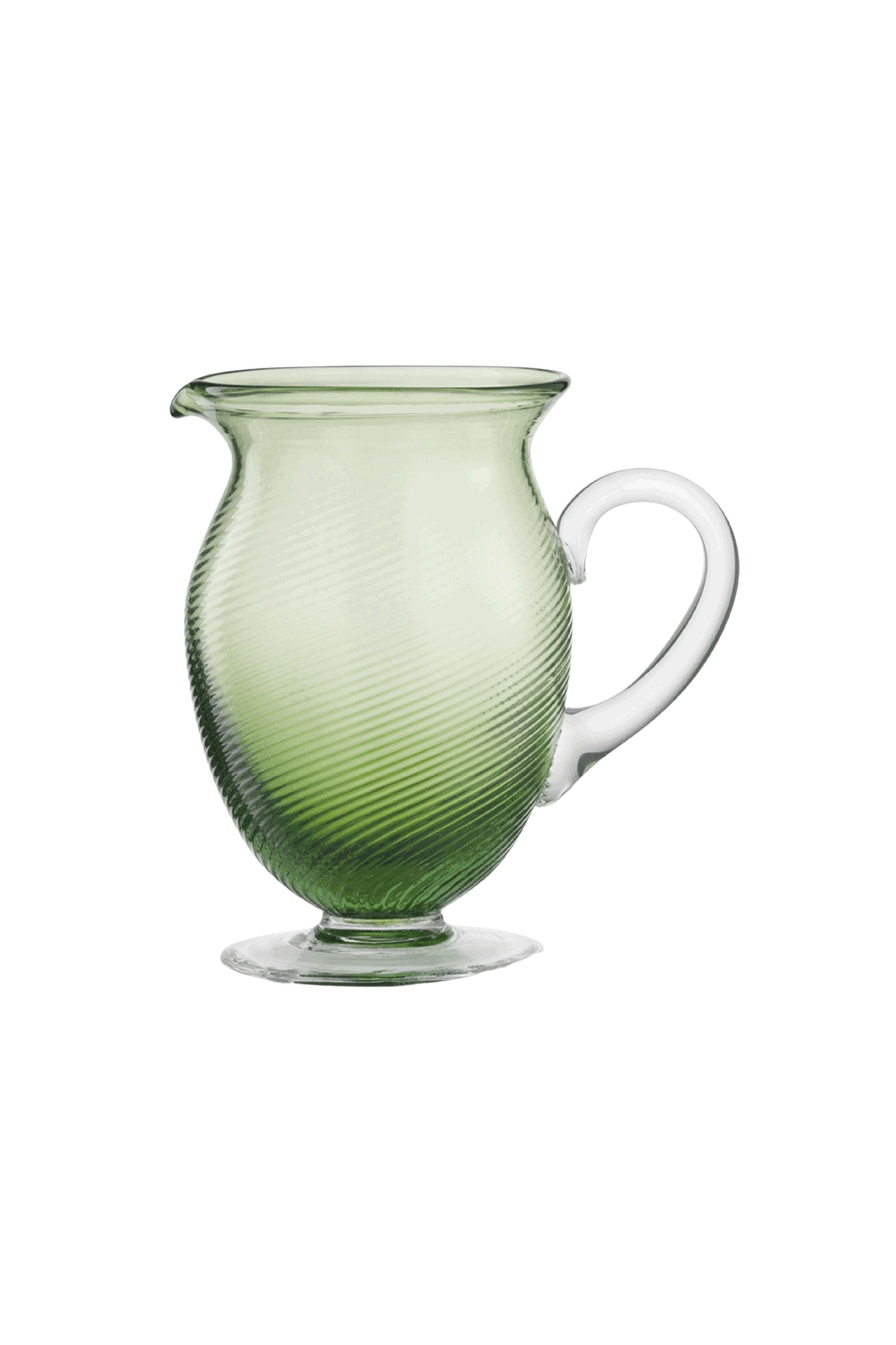 Handblown on the Venetian Island of Murano, these glasses feature a handmade stem and twisted texture in Green. The elegant form made in glass makes this a versatile chameleon to be used with stoneware or china.