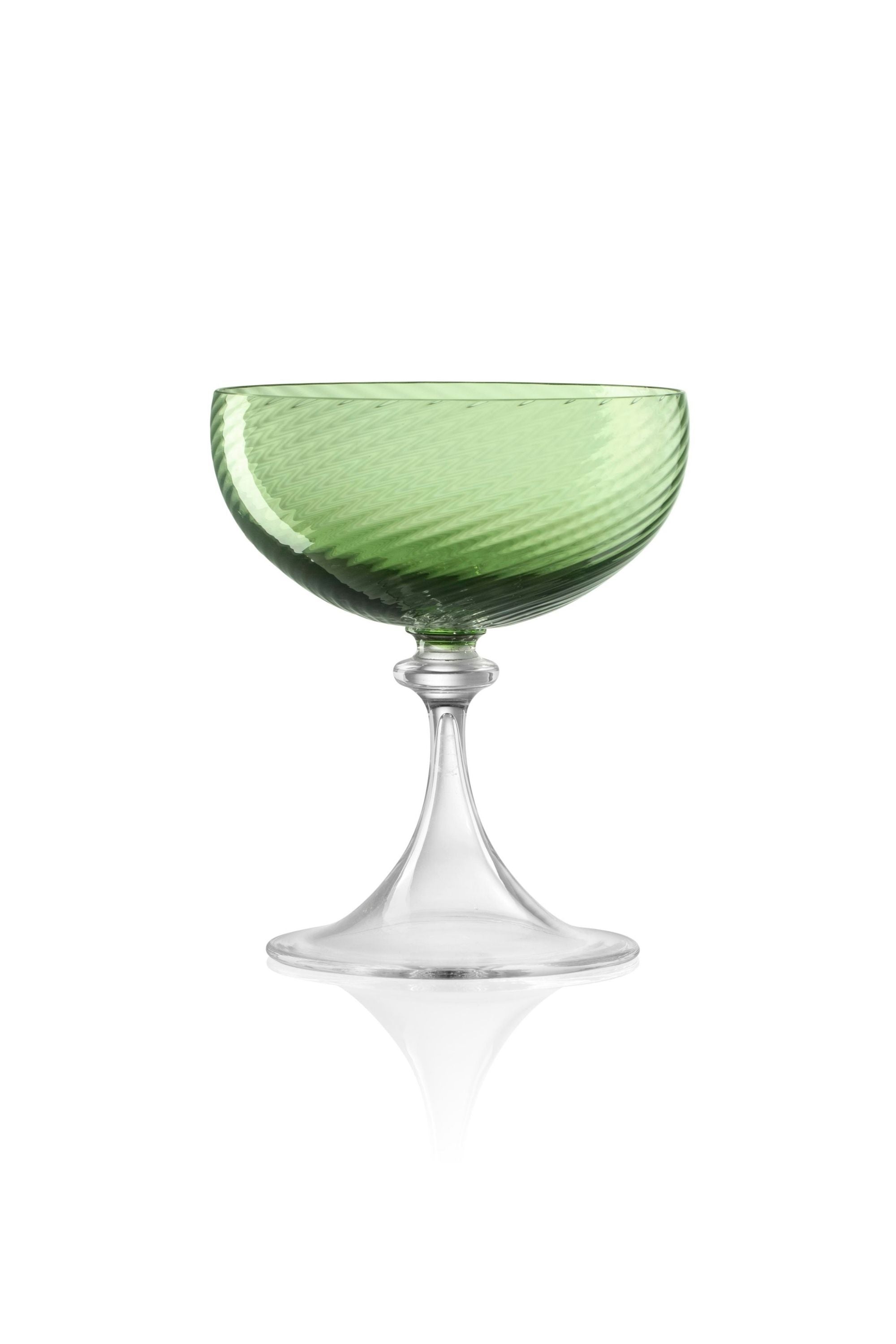 Handblown on the Venetian Island of Murano, these glasses feature a handmade stem and twisted texture in Green. The elegant form made in glass makes this a versatile chameleon to be used with stoneware or china.