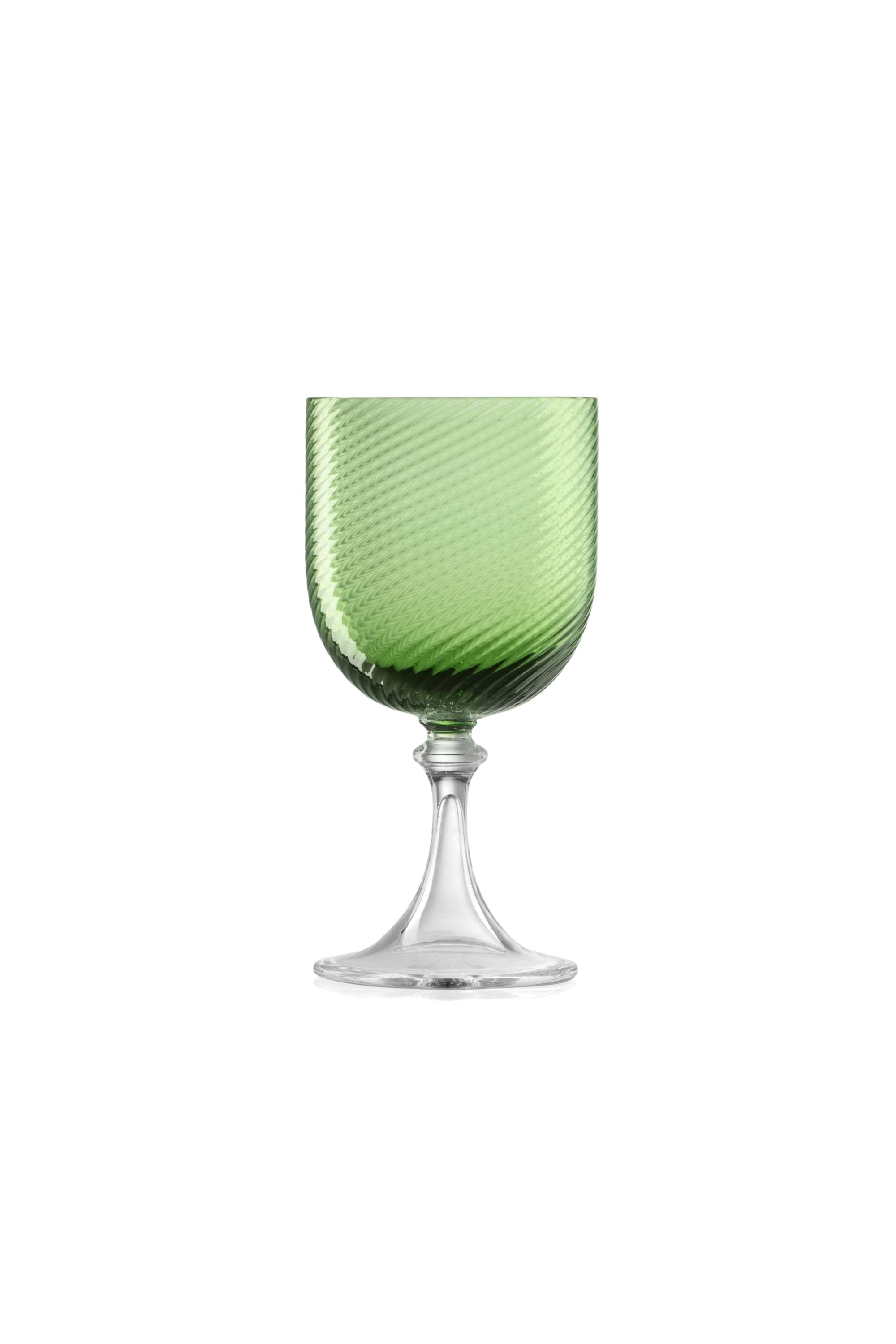 Handblown on the Venetian Island of Murano, these glasses feature a handmade stem and twisted texture in Green. The elegant form made in glass makes this a versatile chameleon to be used with stoneware or china.