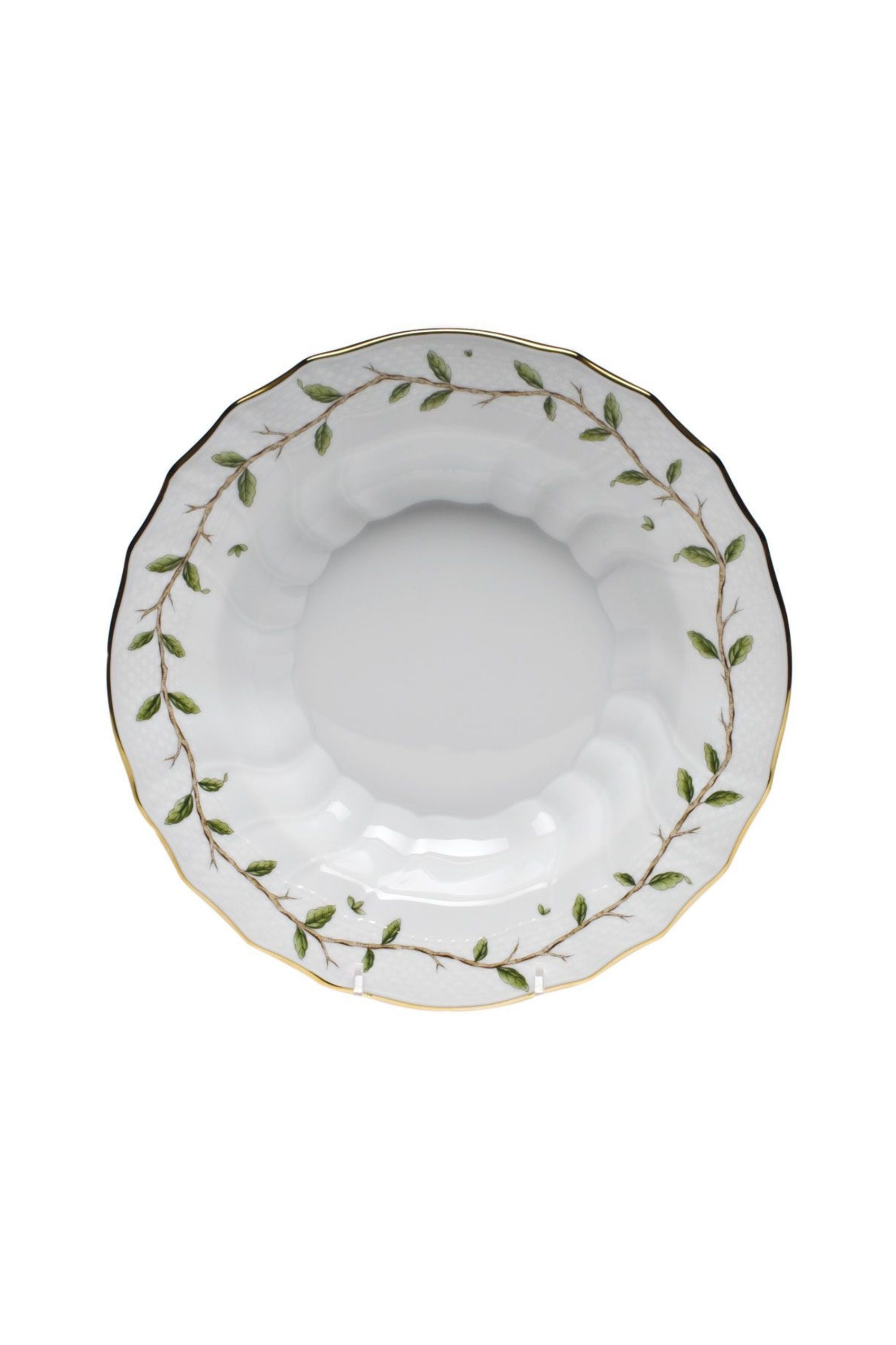 Porcelain dinnerware with garden and vine inspired theme.