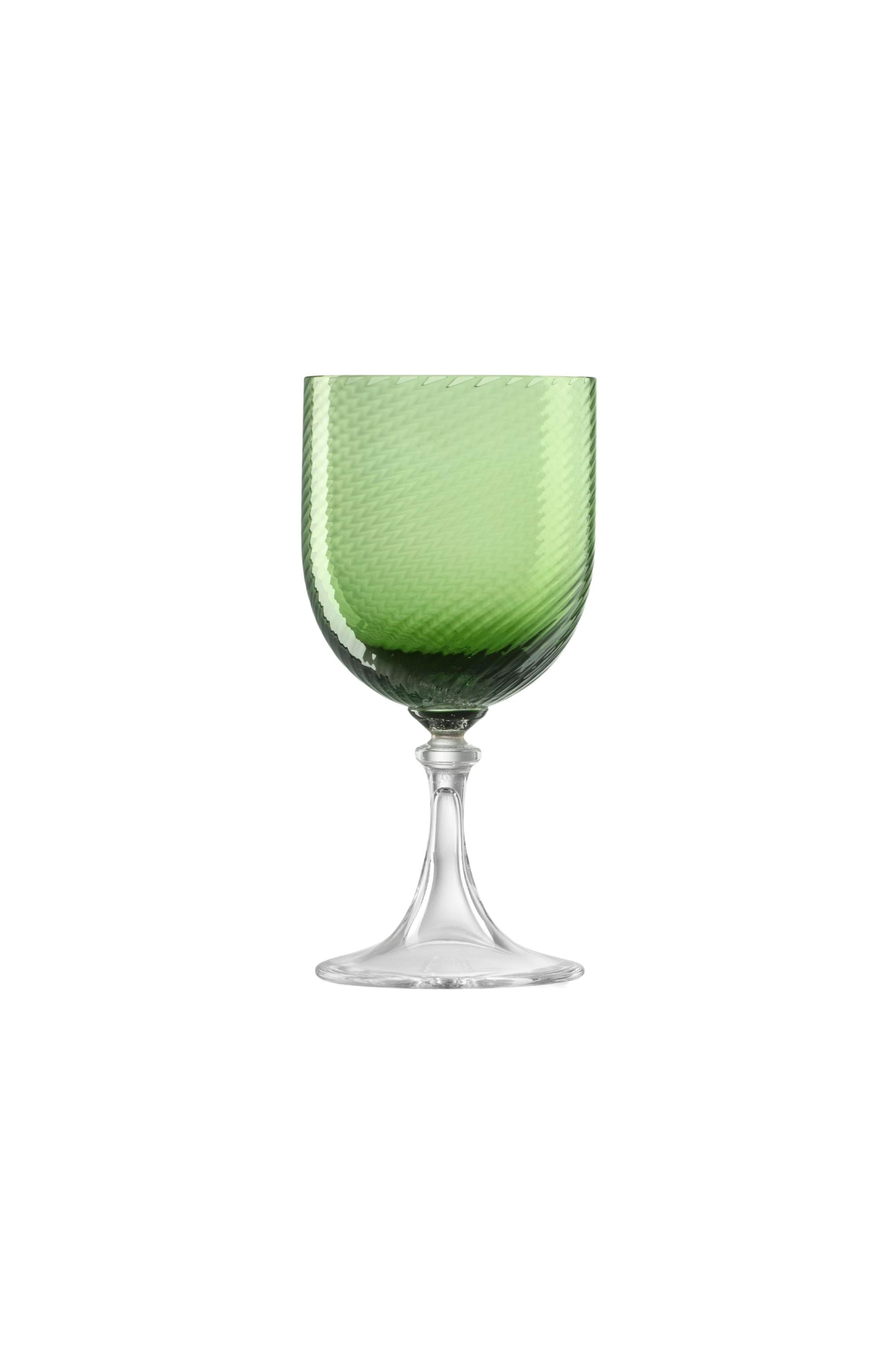 Handblown on the Venetian Island of Murano, these glasses feature a handmade stem and twisted texture in Green. The elegant form made in glass makes this a versatile chameleon to be used with stoneware or china.