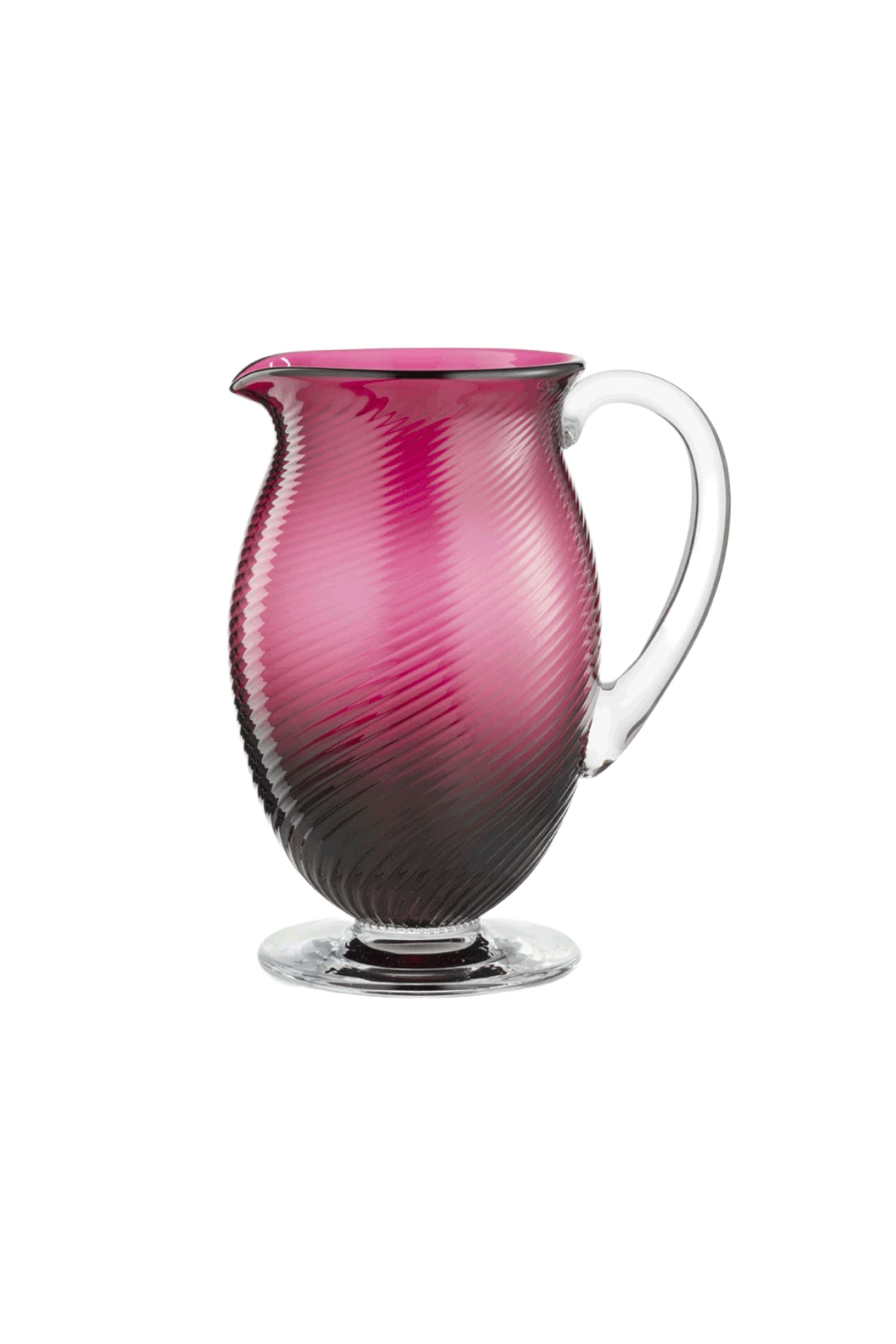 Handblown on the Venetian Island of Murano, these glasses feature a handmade stem and twisted texture in Ruby Red. The elegant form made in glass makes this a versatile chameleon to be used with stoneware or china.
