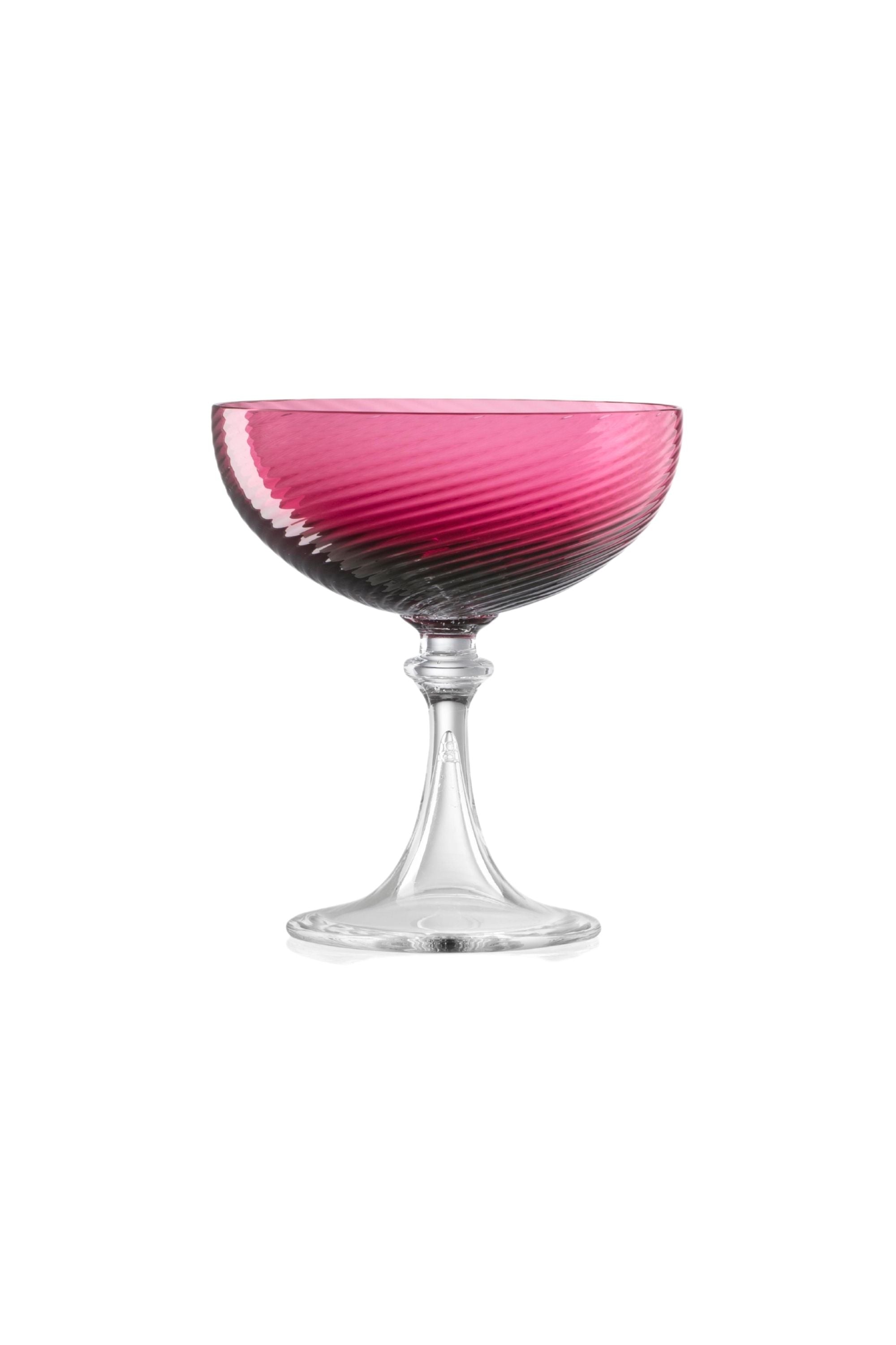 Handblown on the Venetian Island of Murano, these glasses feature a handmade stem and twisted texture in Ruby Red. The elegant form made in glass makes this a versatile chameleon to be used with stoneware or china.