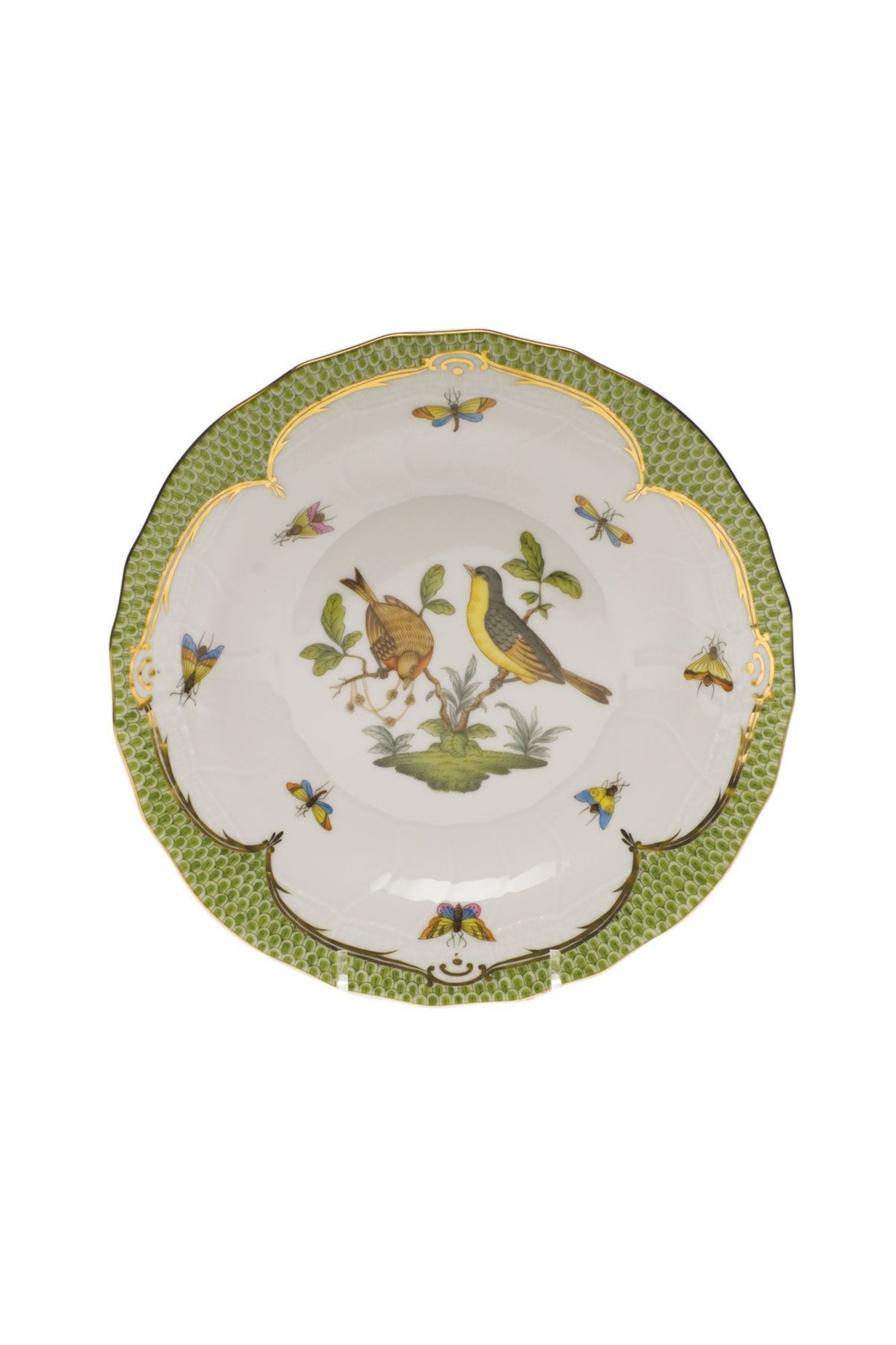 Green porcelain dinnerware. Rothschild Bird is a lush design featuring the highly recognizable bird motif framed by tiny hand-painted fish scales outlined in 24-karat gold.