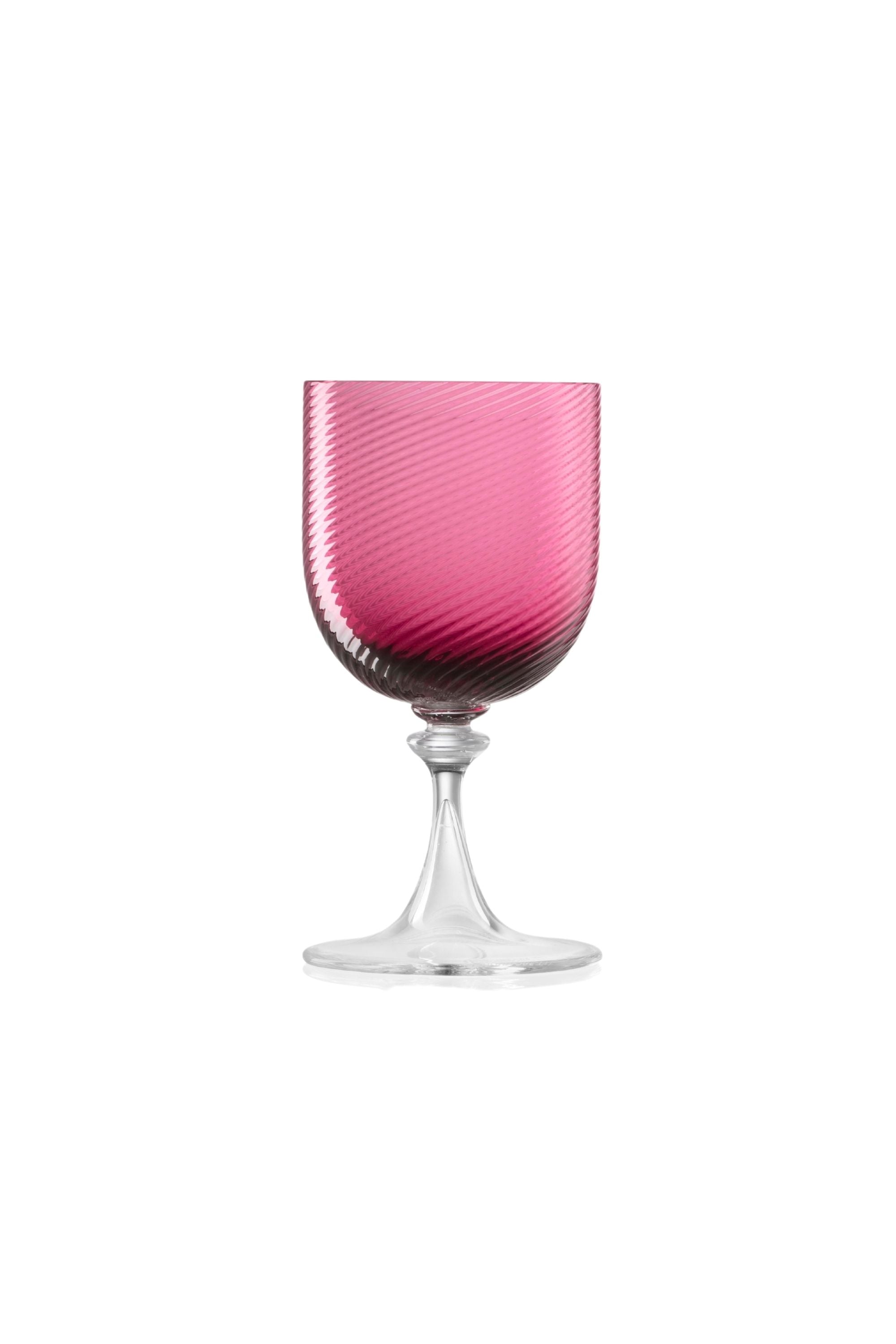 Handblown on the Venetian Island of Murano, these glasses feature a handmade stem and twisted texture in Ruby Red. The elegant form made in glass makes this a versatile chameleon to be used with stoneware or china.
