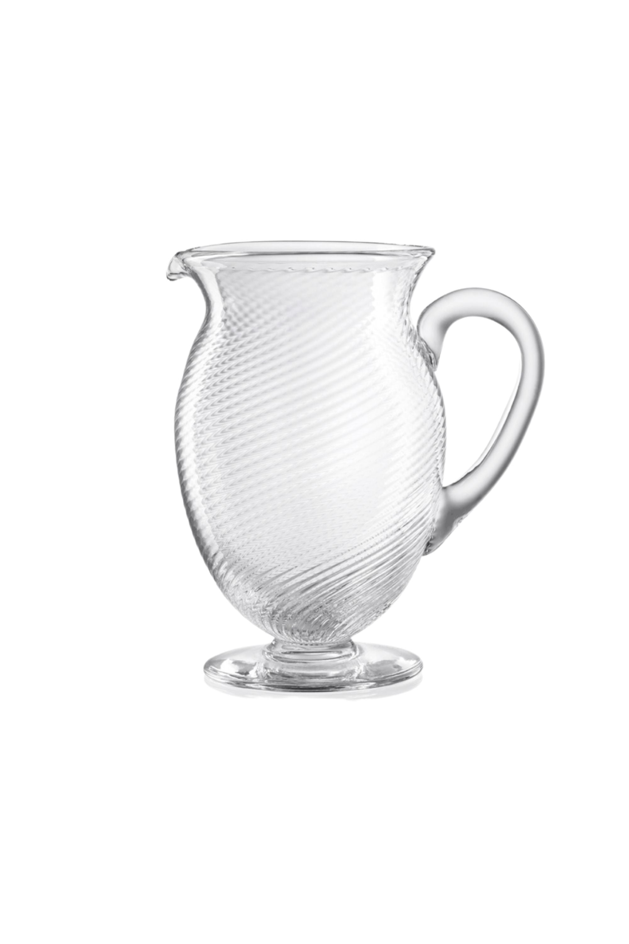 Handblown on the Venetian Island of Murano, these glasses feature a handmade stem and twisted texture in Clear. The elegant form made in glass makes this a versatile chameleon to be used with stoneware or china.