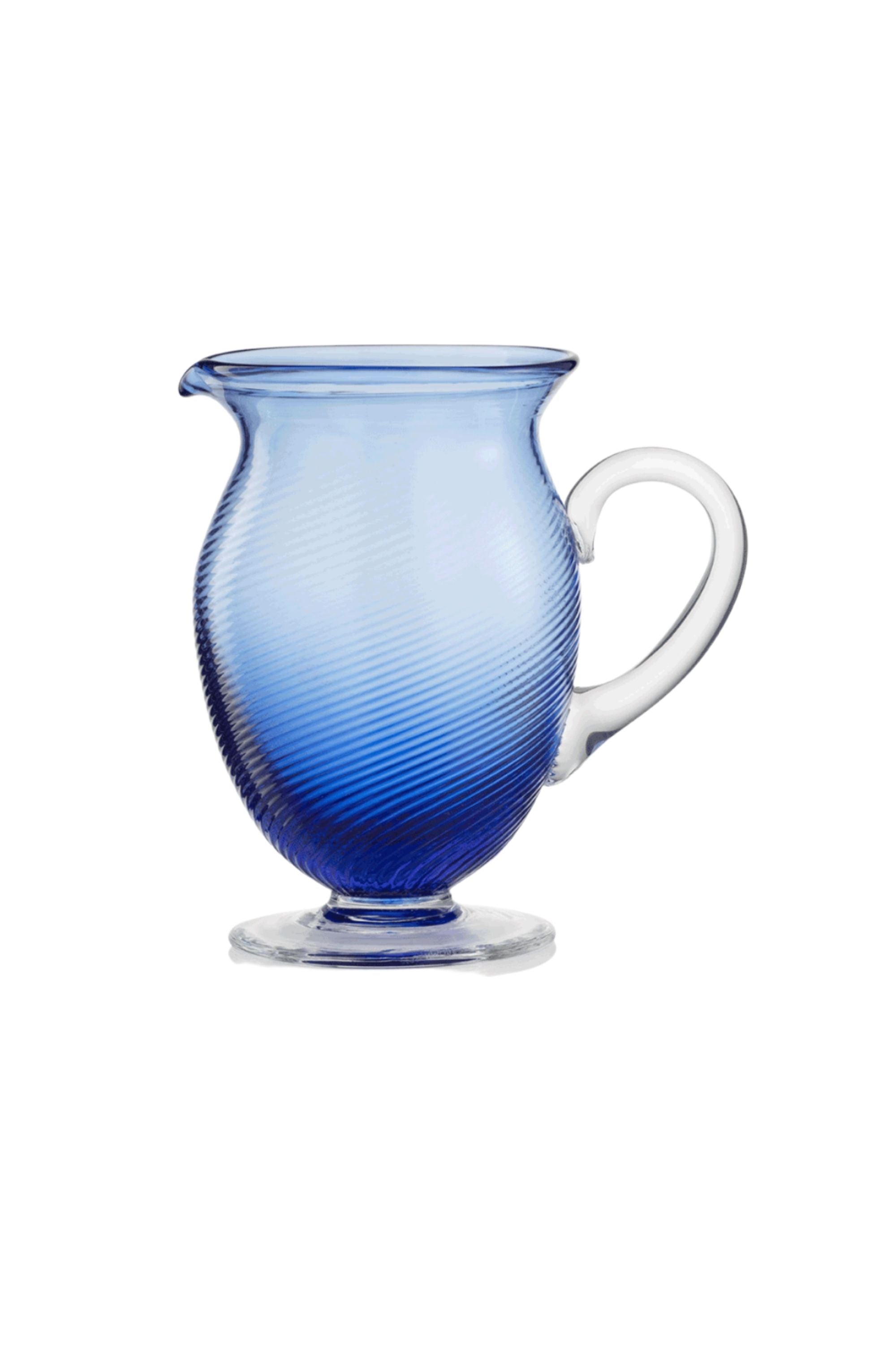 Handblown on the Venetian Island of Murano, these glasses feature a handmade stem and twisted texture in Blue. The elegant form made in glass makes this a versatile chameleon to be used with stoneware or china.