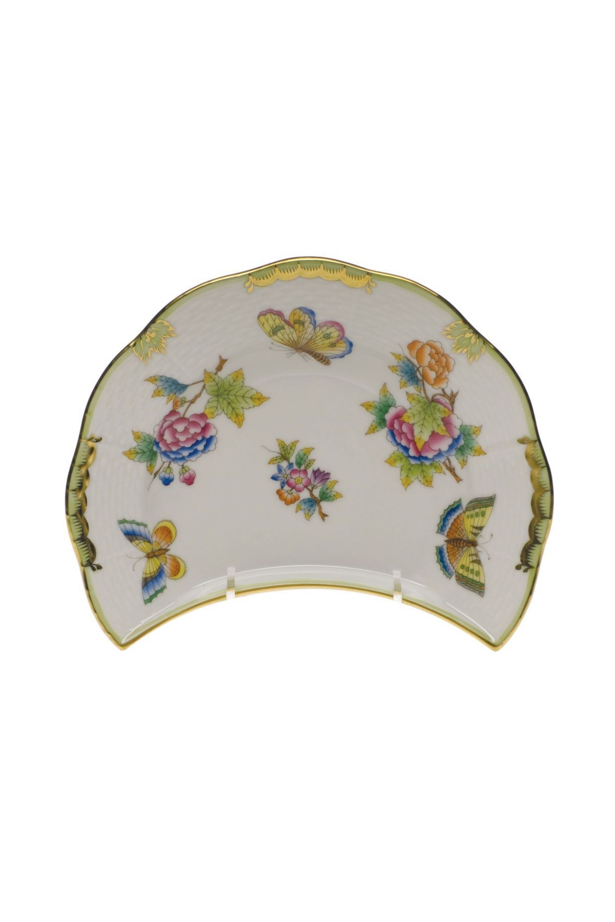 Porcelain dinnerware with butterflies and flowers. The original set, introduced in 1851 at the First World Exhibition in London, was purchased by Queen Victoria herself. Subsequently named for her, this Chinese-influenced pattern demands the skills of Herend's most talented and experienced painters.