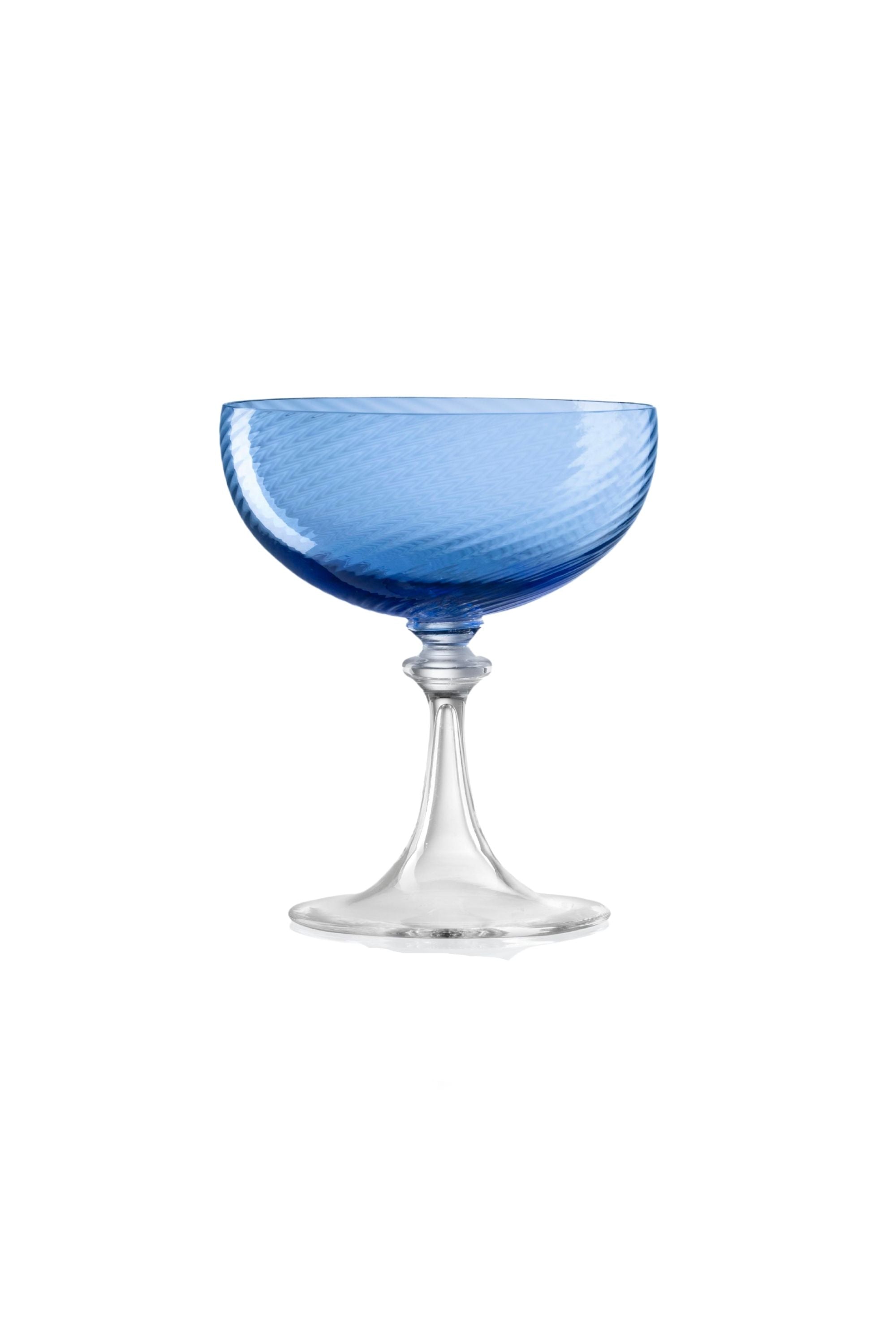 Handblown on the Venetian Island of Murano, these glasses feature a handmade stem and twisted texture in Blue. The elegant form made in glass makes this a versatile chameleon to be used with stoneware or china.